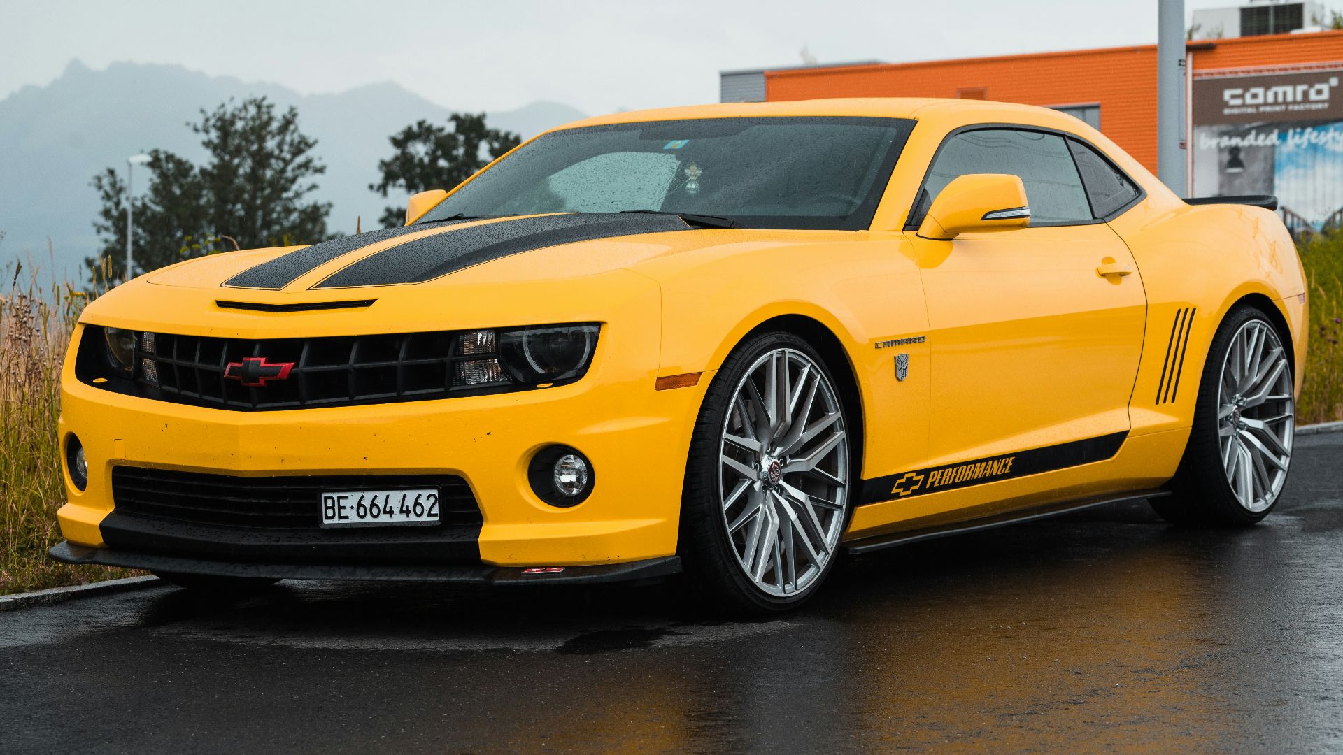 yellow Chevrolet coupe close-up photography