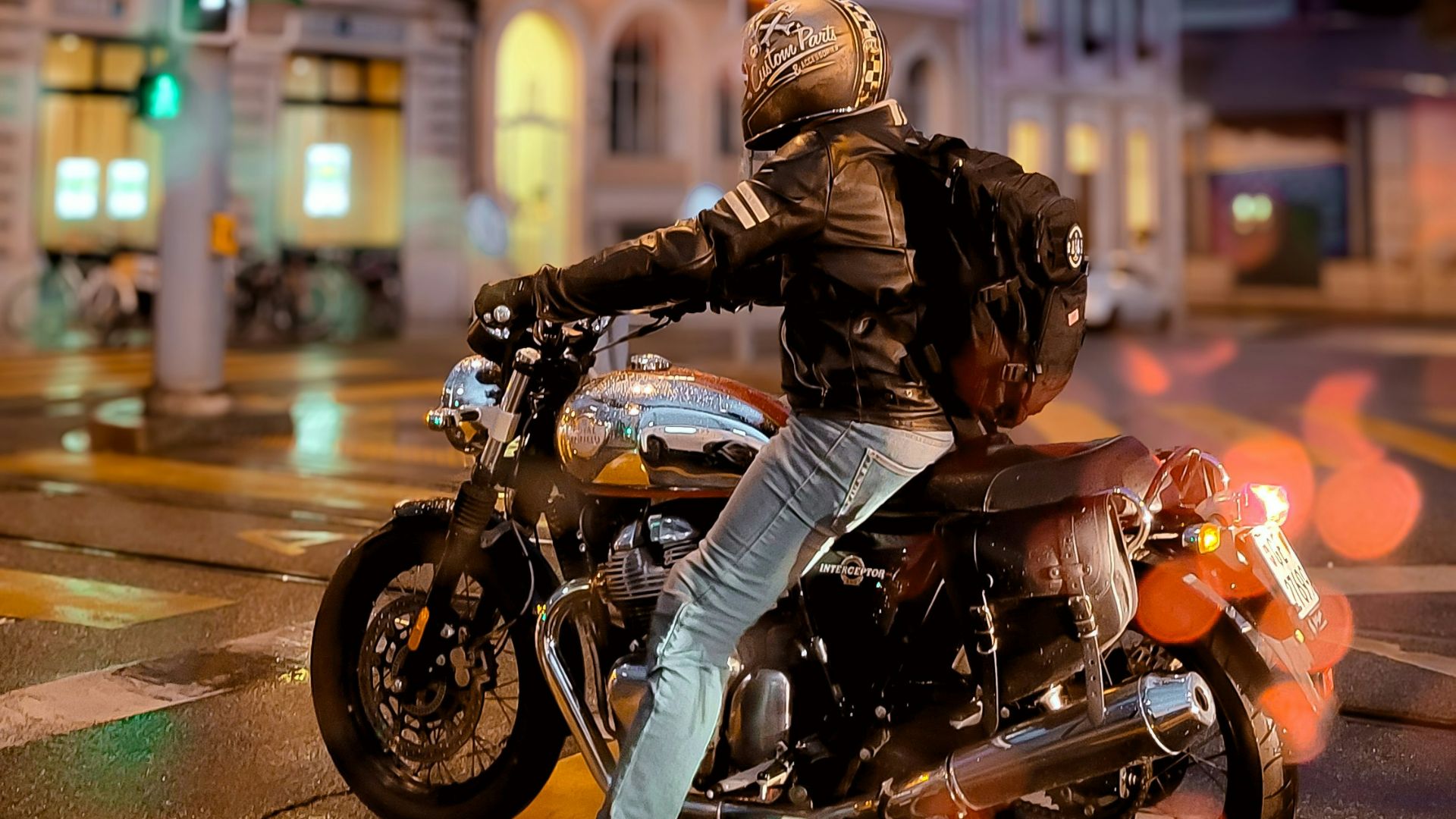 A person riding a motorcycle on a city street