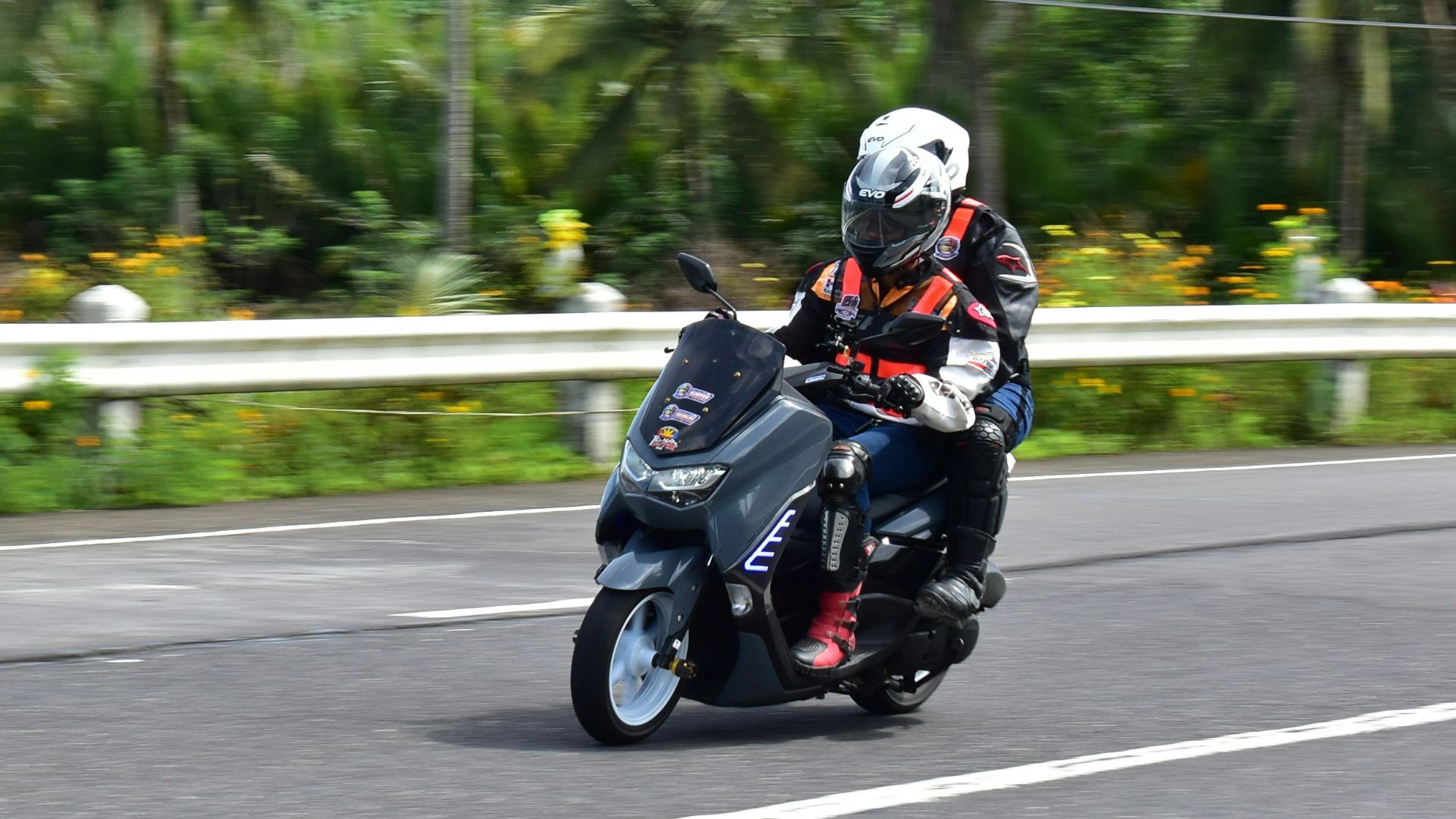 a person riding a motorcycle on a road