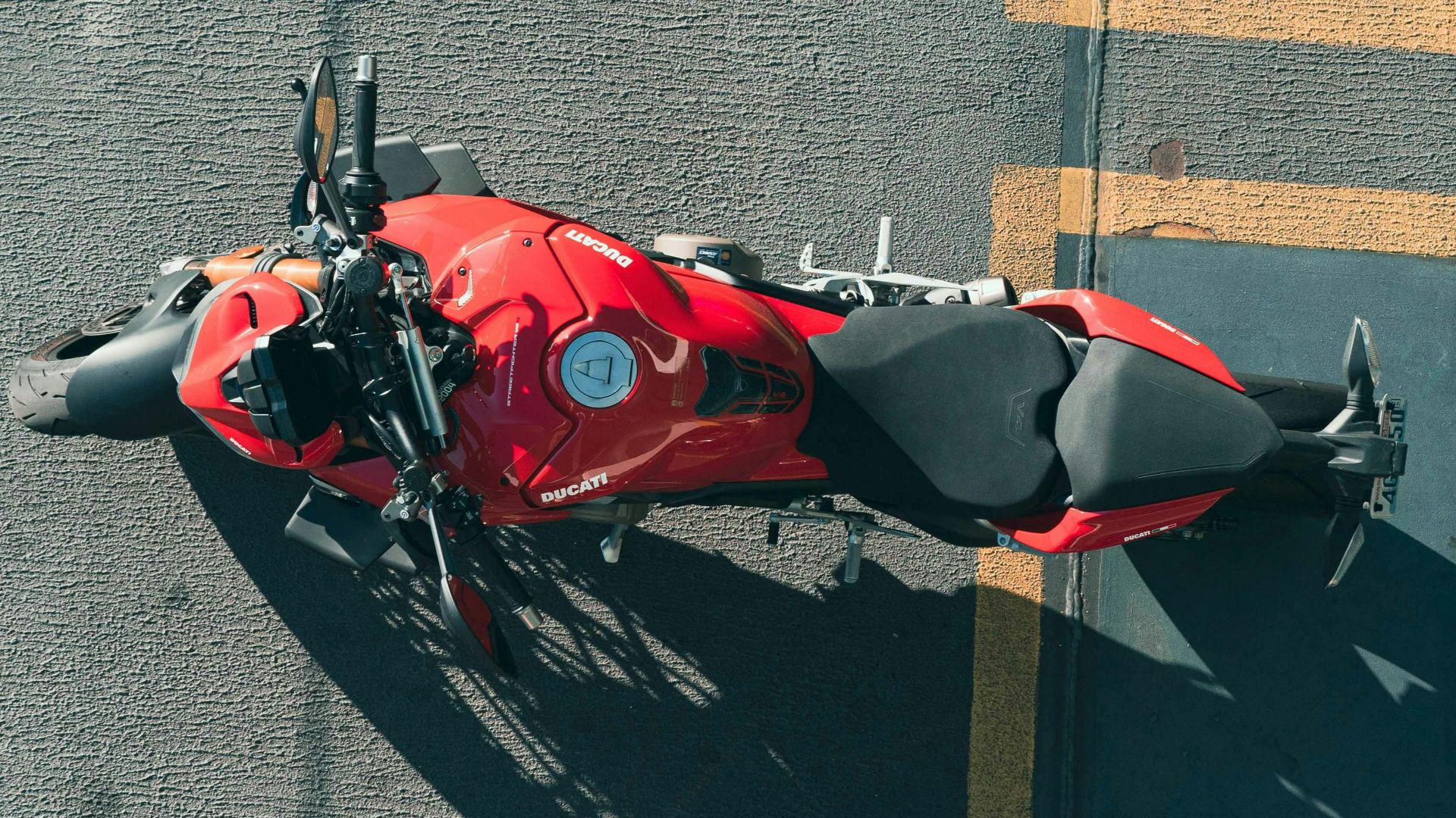 red and black sports car on road during daytime
