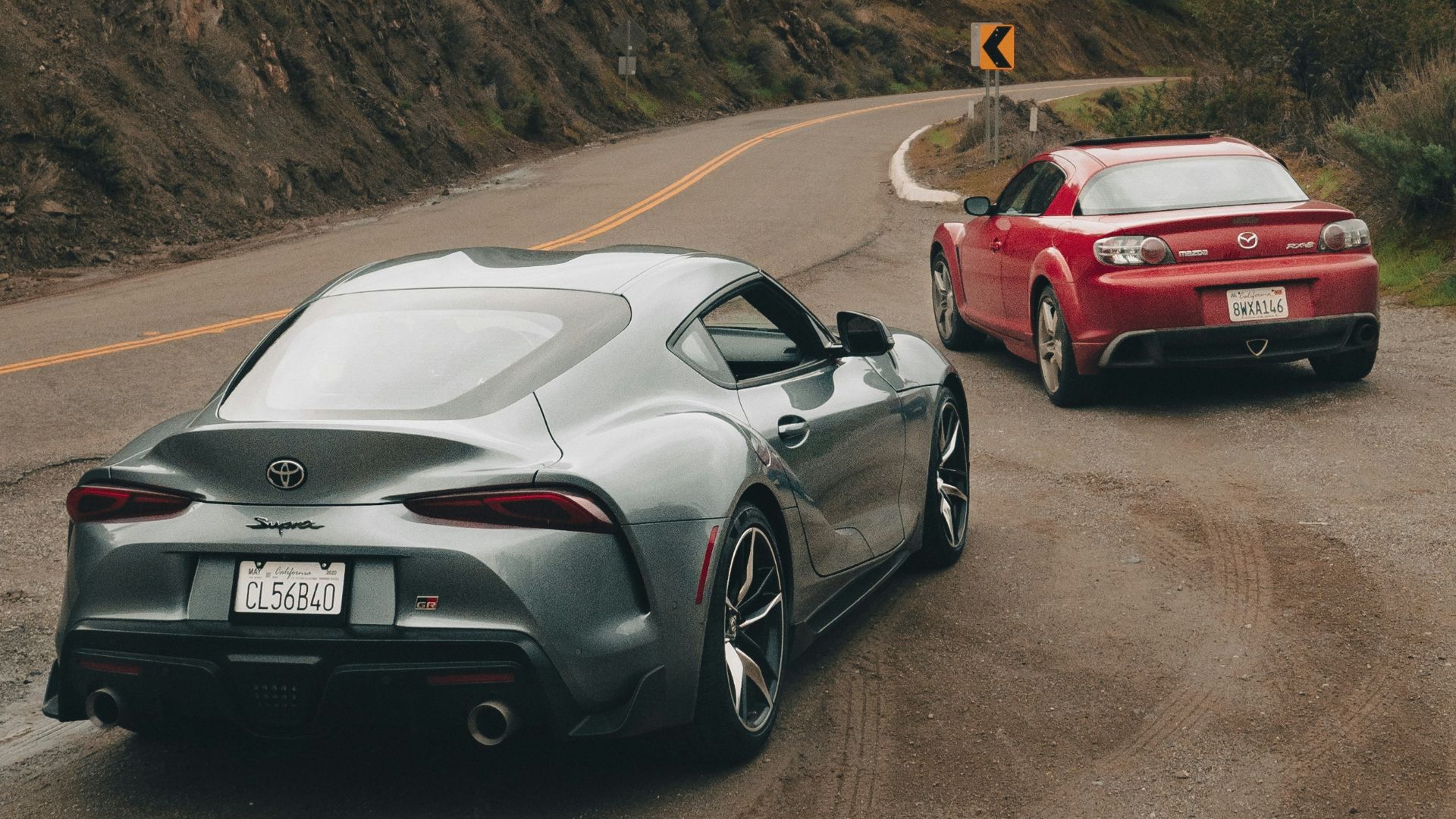 a couple of cars that are sitting in the street