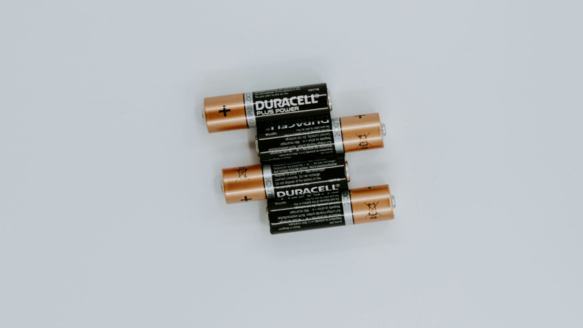 four black Duracell batteries