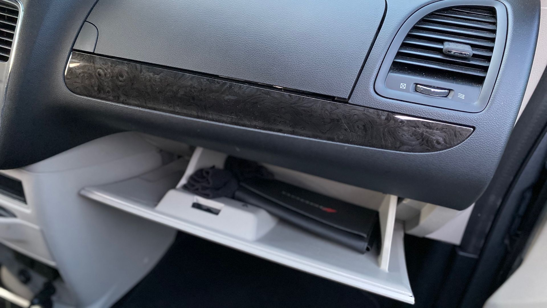 File:2018 Dodge Grand Caravan SE in silver - view of the lower glove box open.jpg