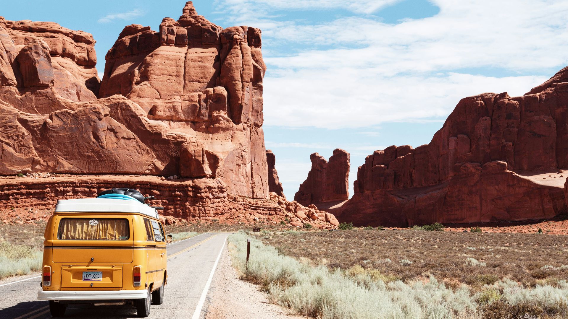 yellow Volkswagen van on road