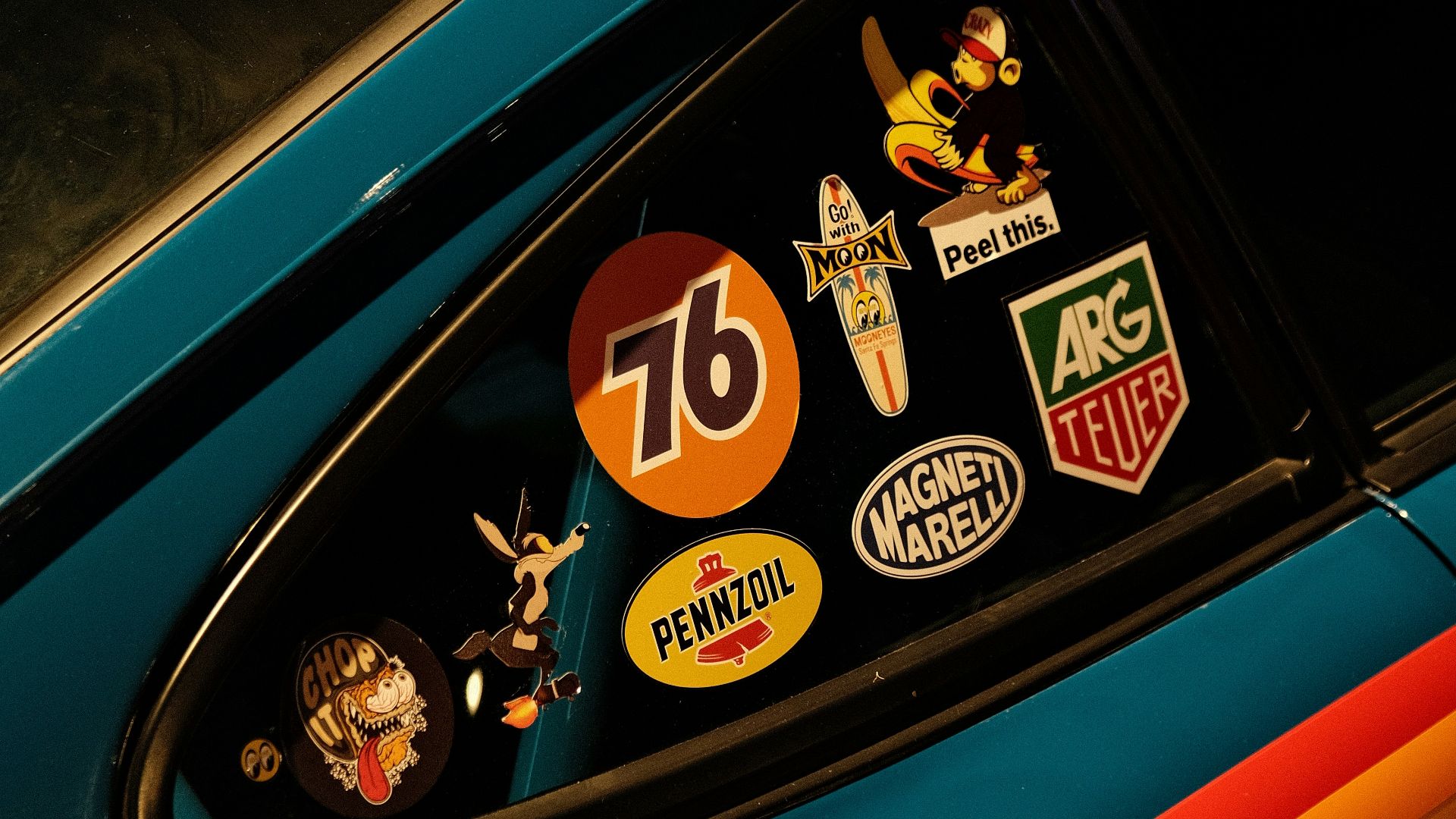 a close up of a car with stickers on it