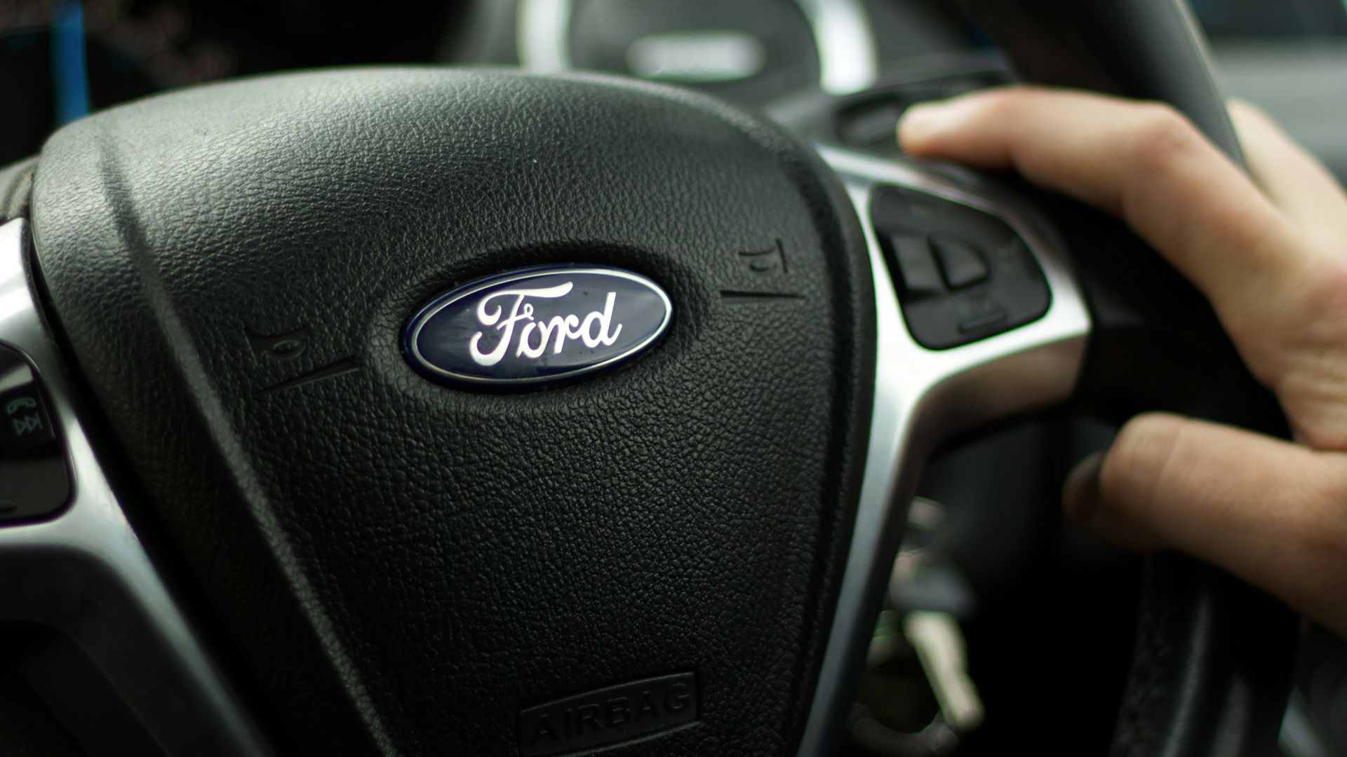 black nissan car steering wheel