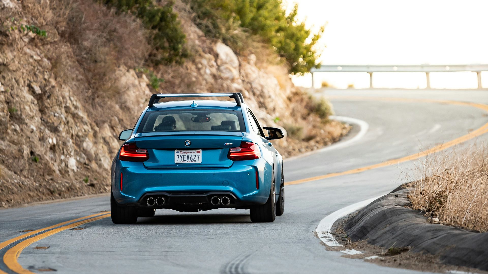 blue car on road during daytime