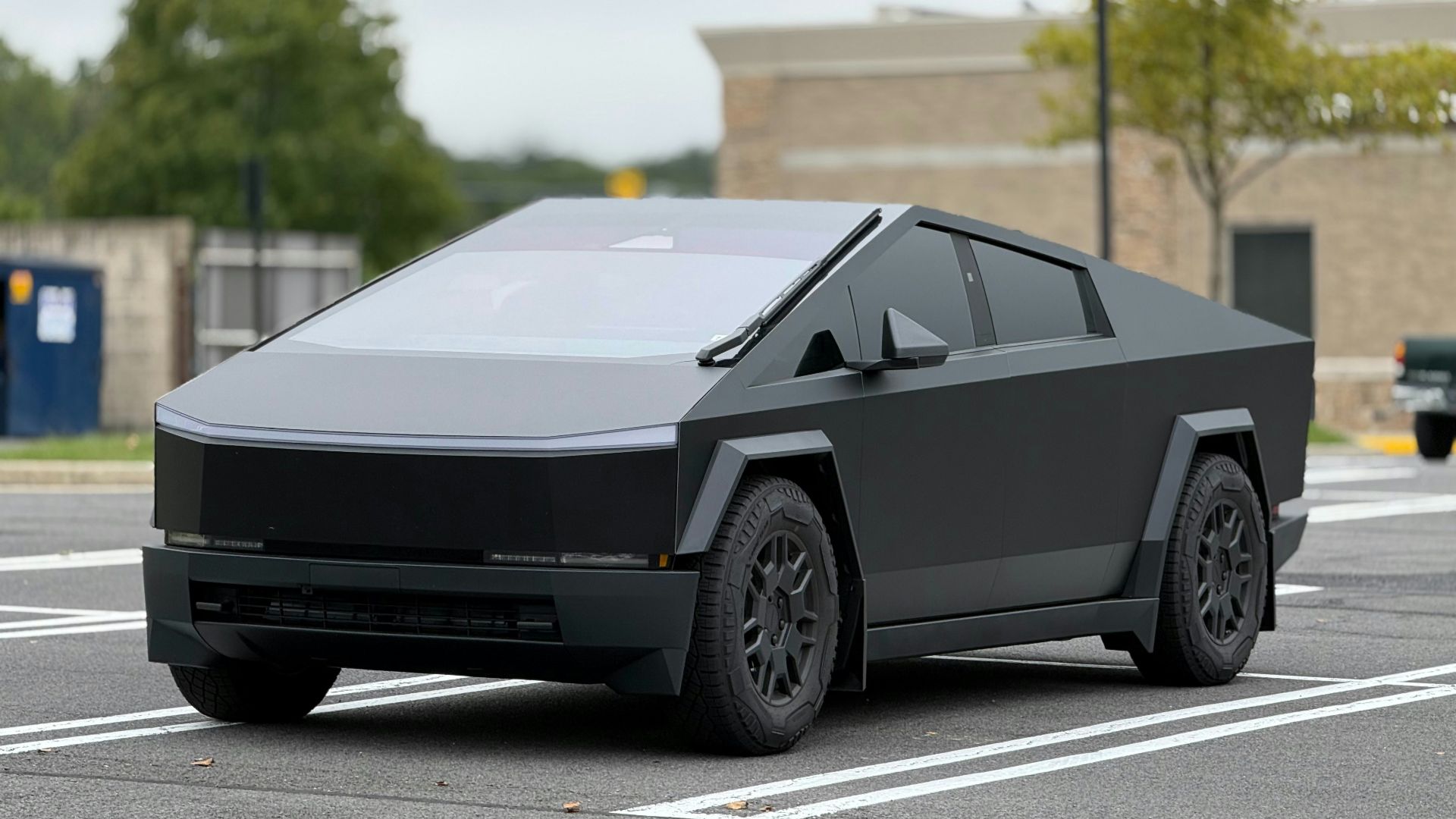 A futuristic car is parked in a parking lot