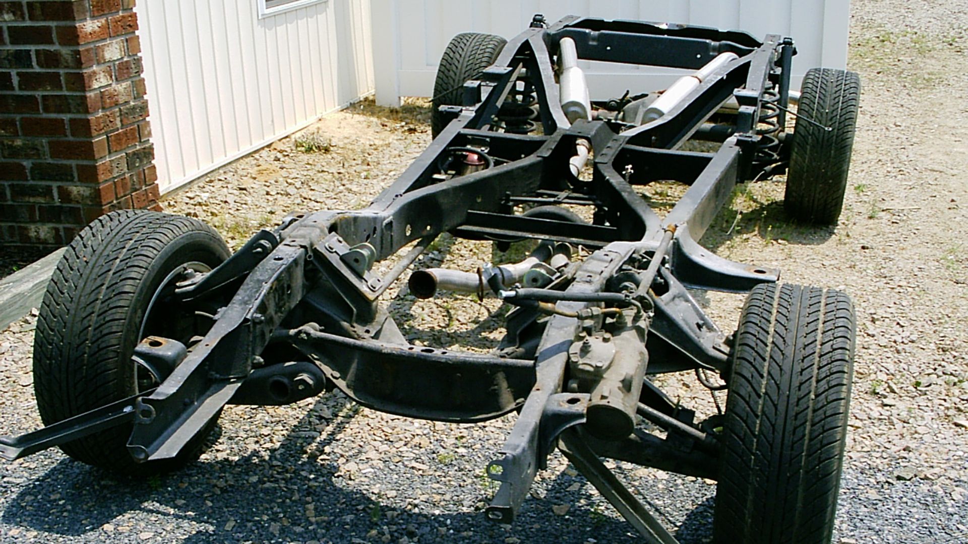 File:Chassis with suspension and exhaust system.jpg