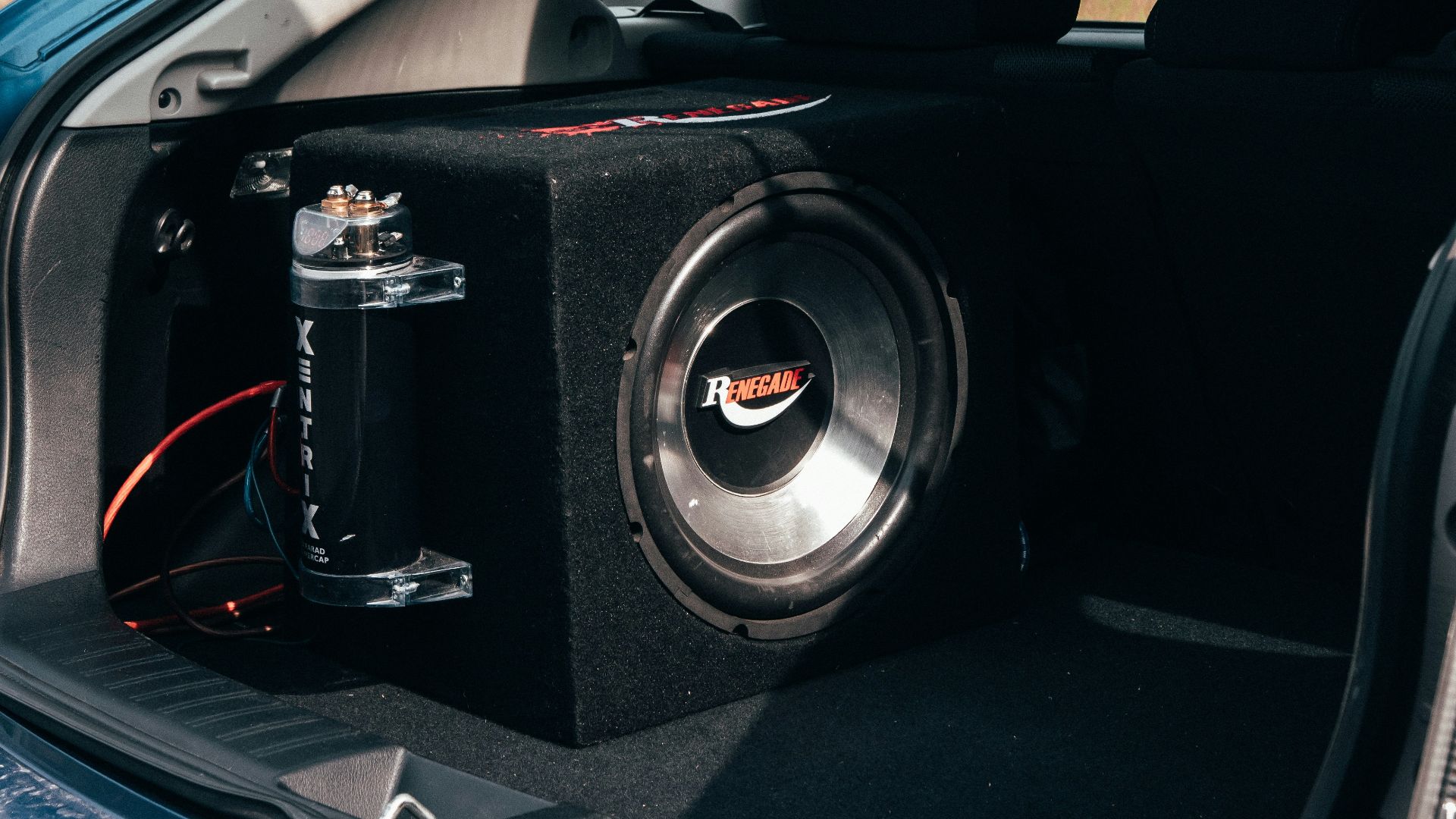 a car with a sub box in the trunk