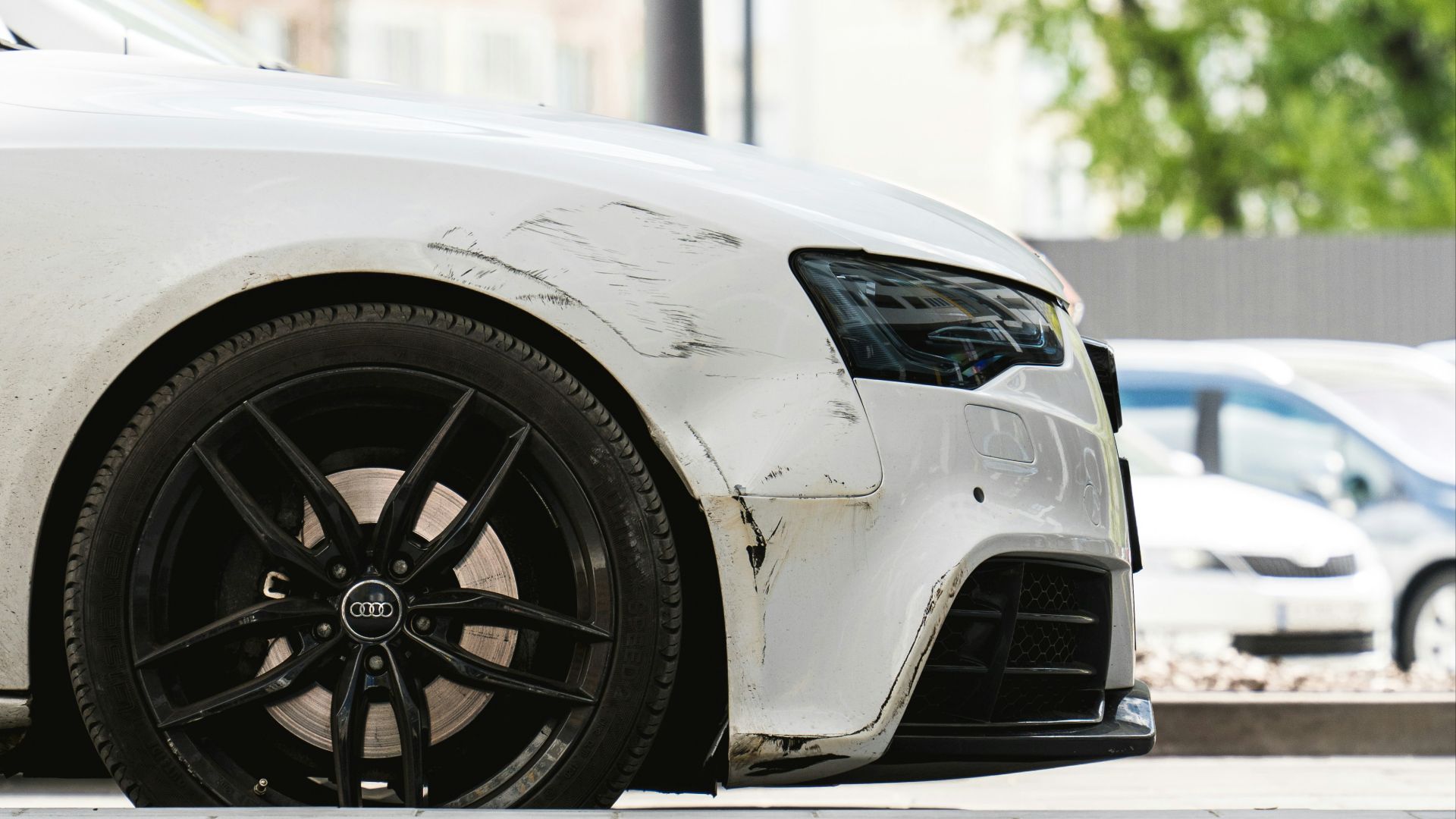 a white car parked on the side of the road