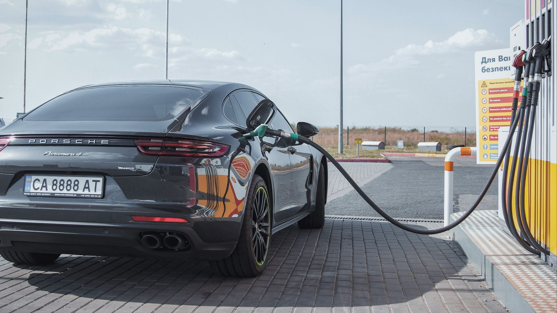 black bmw m 3 parked on sidewalk during daytime