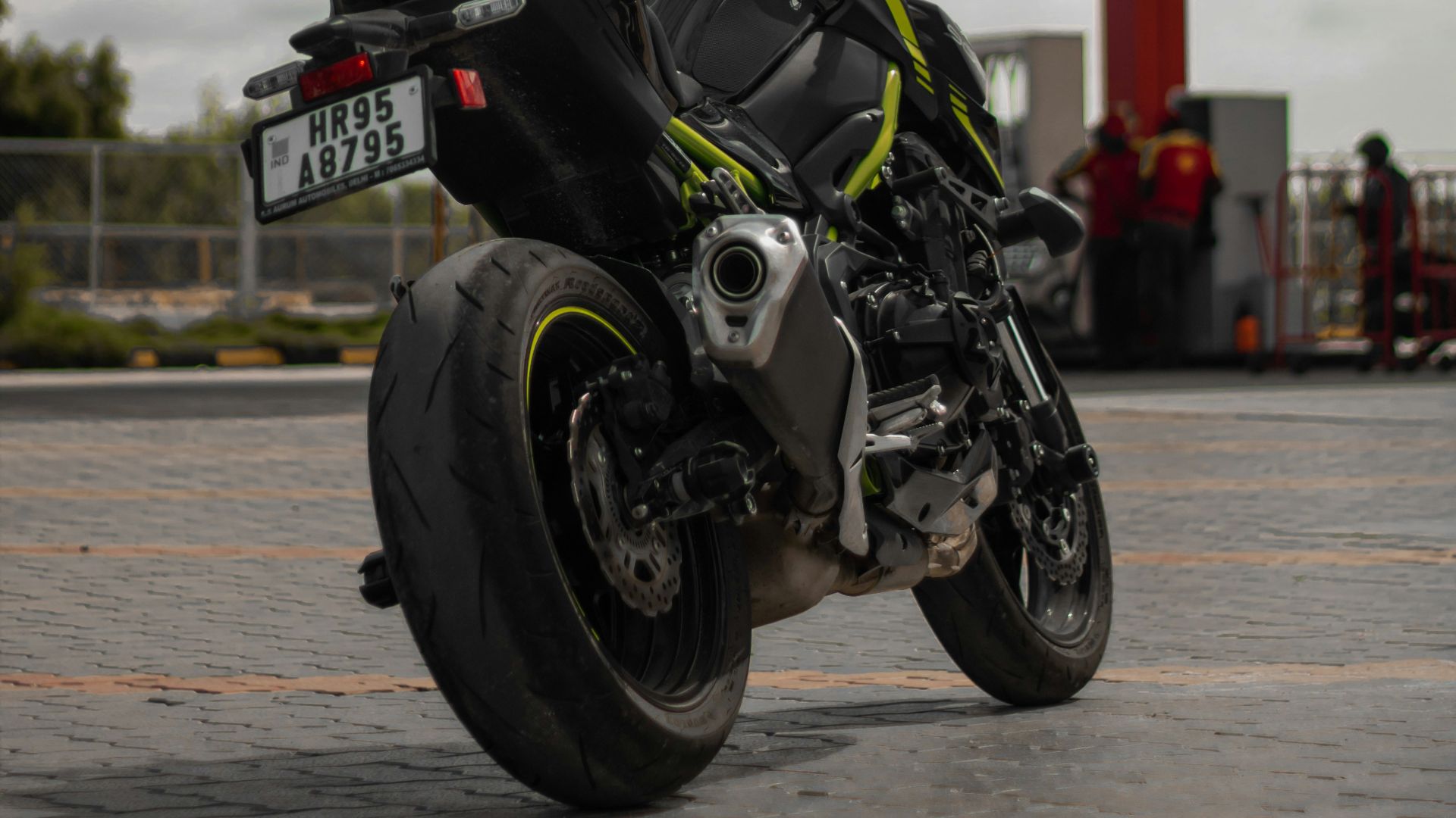 a motorcycle parked in front of a gas station