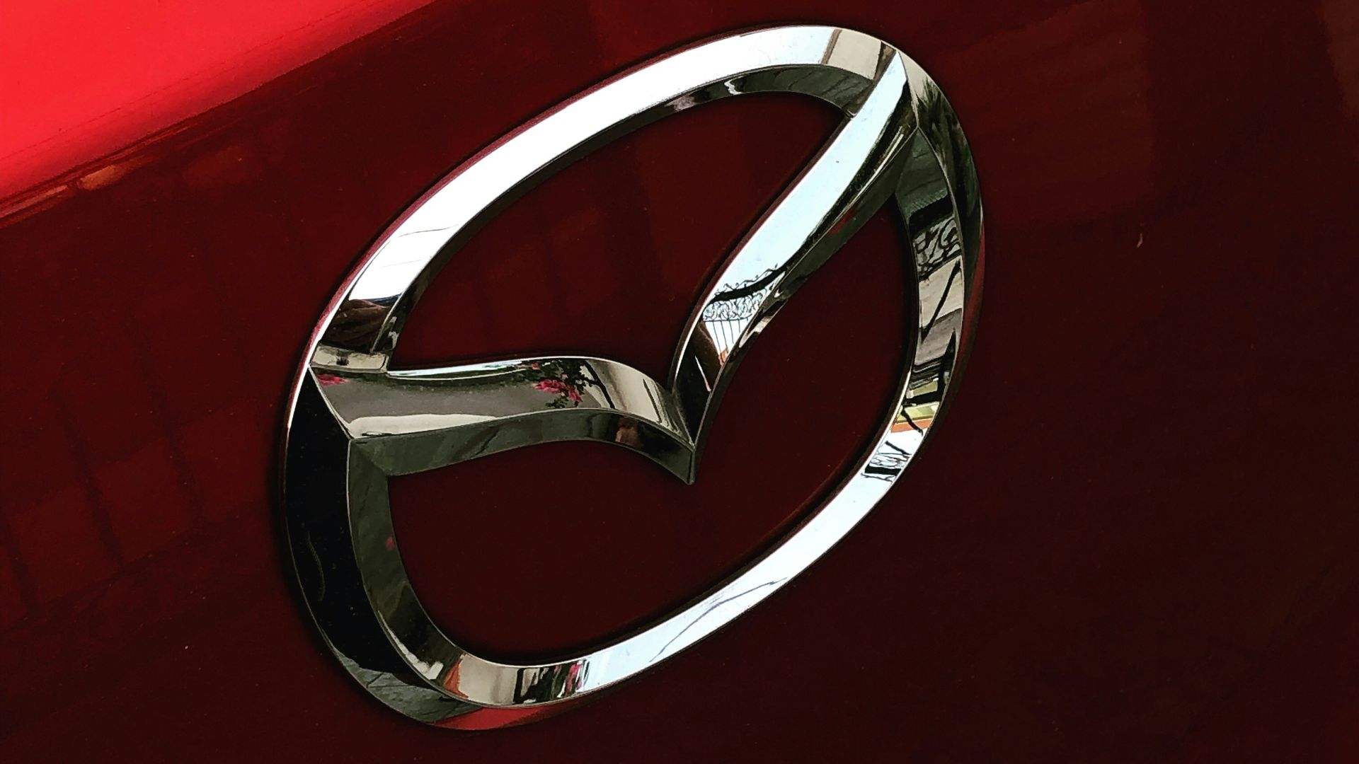 silver Mazda emblem