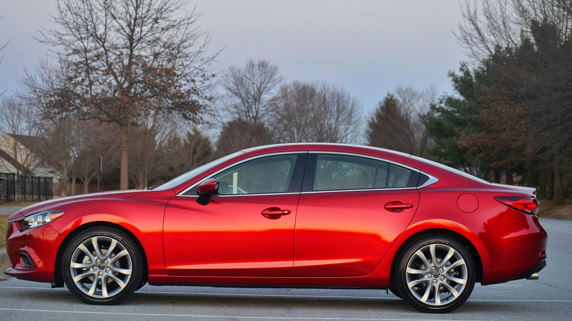 a red car parked on a street