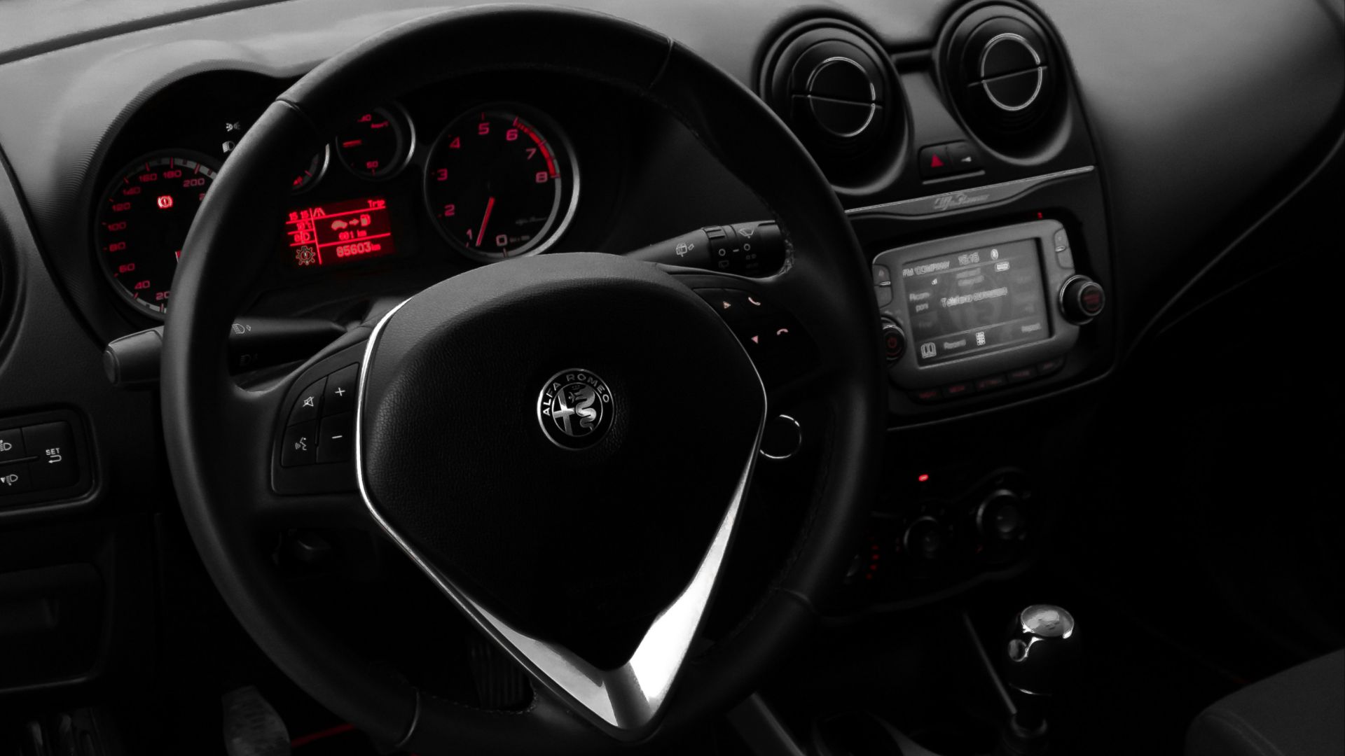 the interior of a car with black leather seats