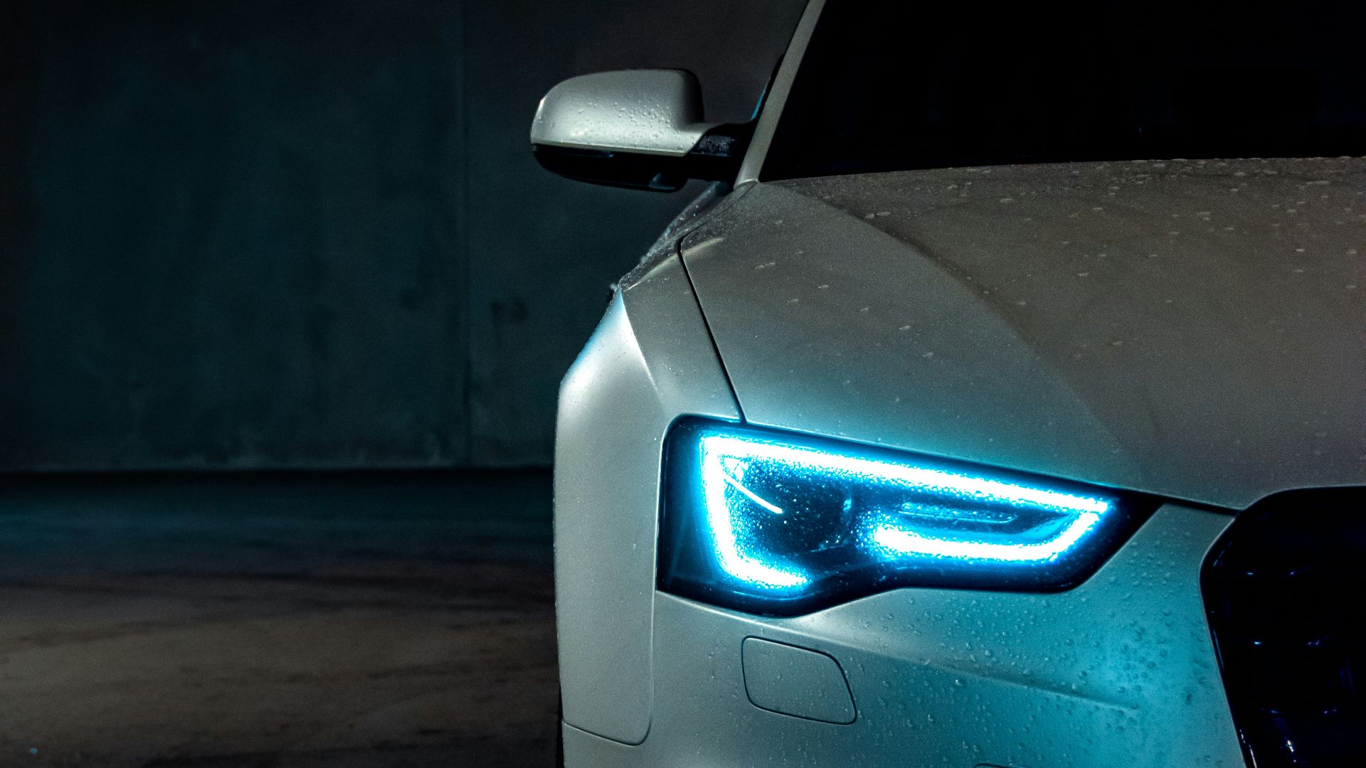 white vehicle with blue neon headlight bulb