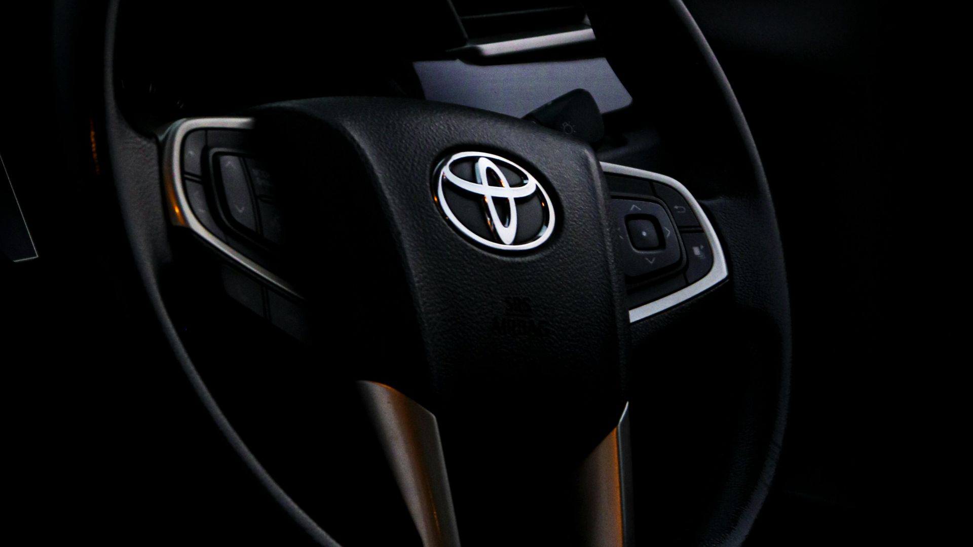 black and silver mercedes benz steering wheel