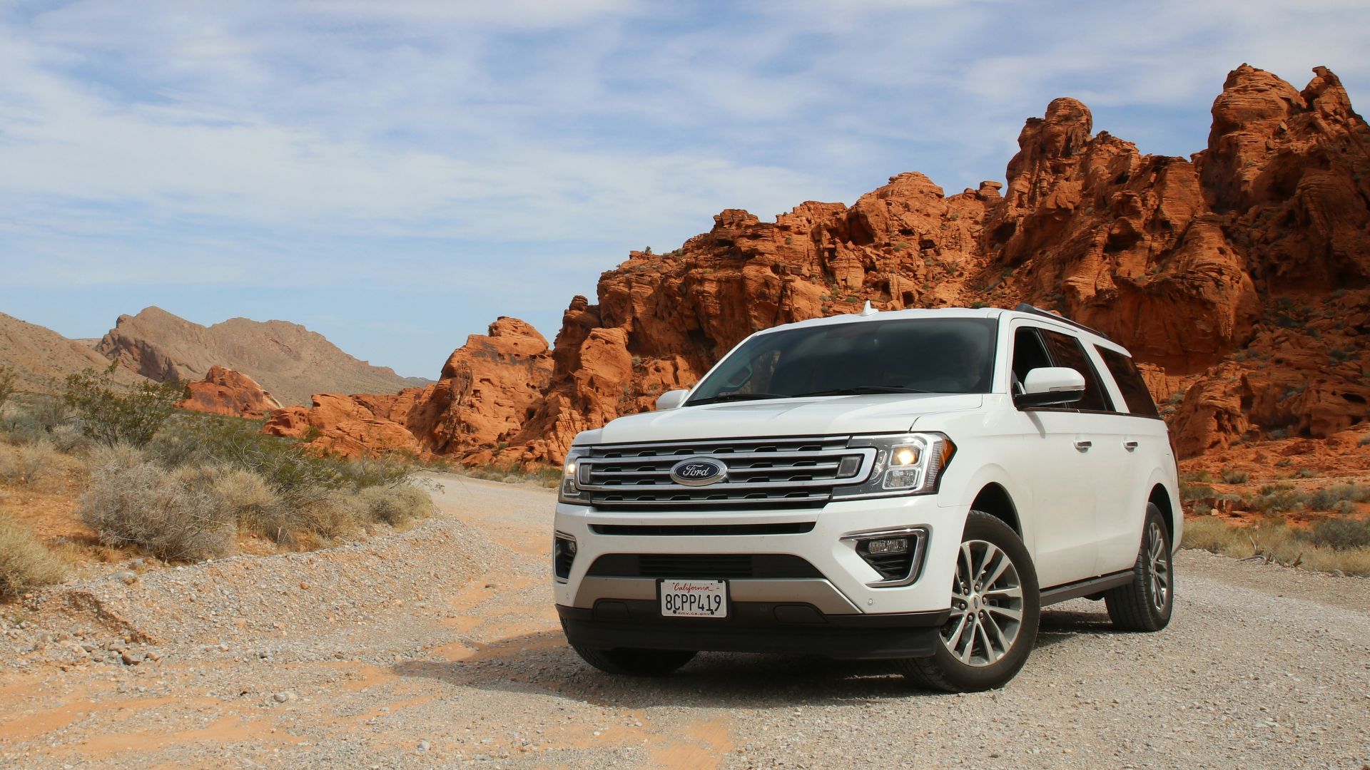 parked white Ford Explorer SUV