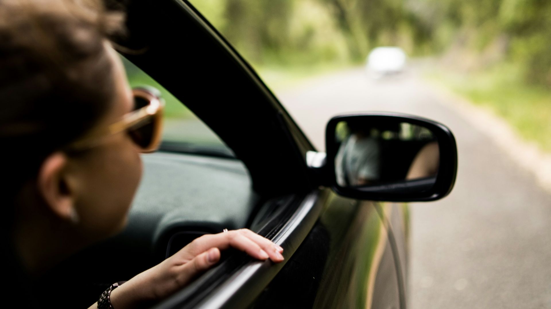 woman sitting inside vehicle