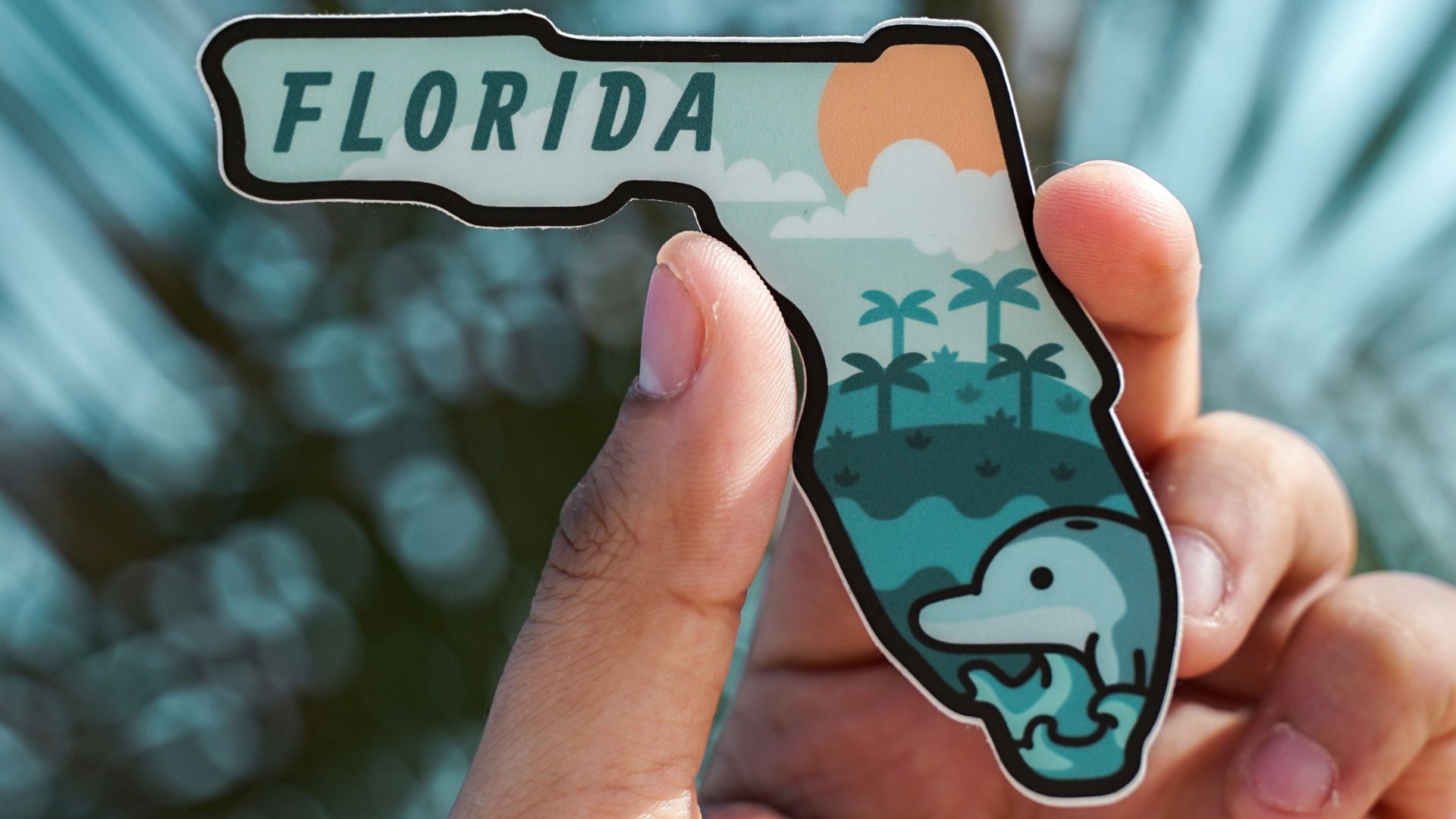 person holding white and black iphone case