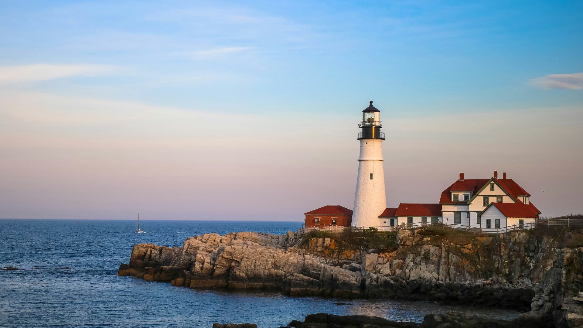 white lighthouse near body of water