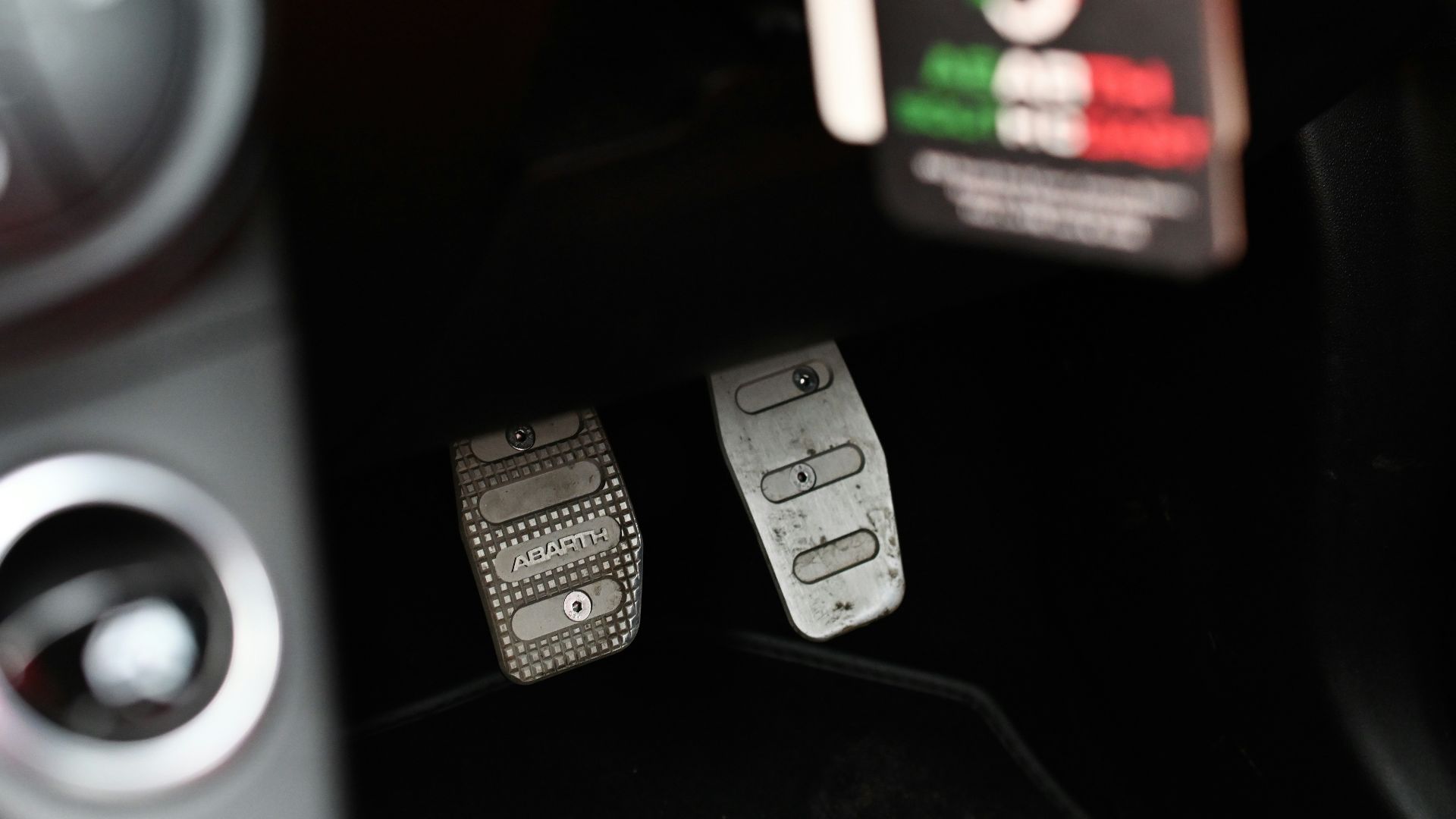 a close up of metal car pedals