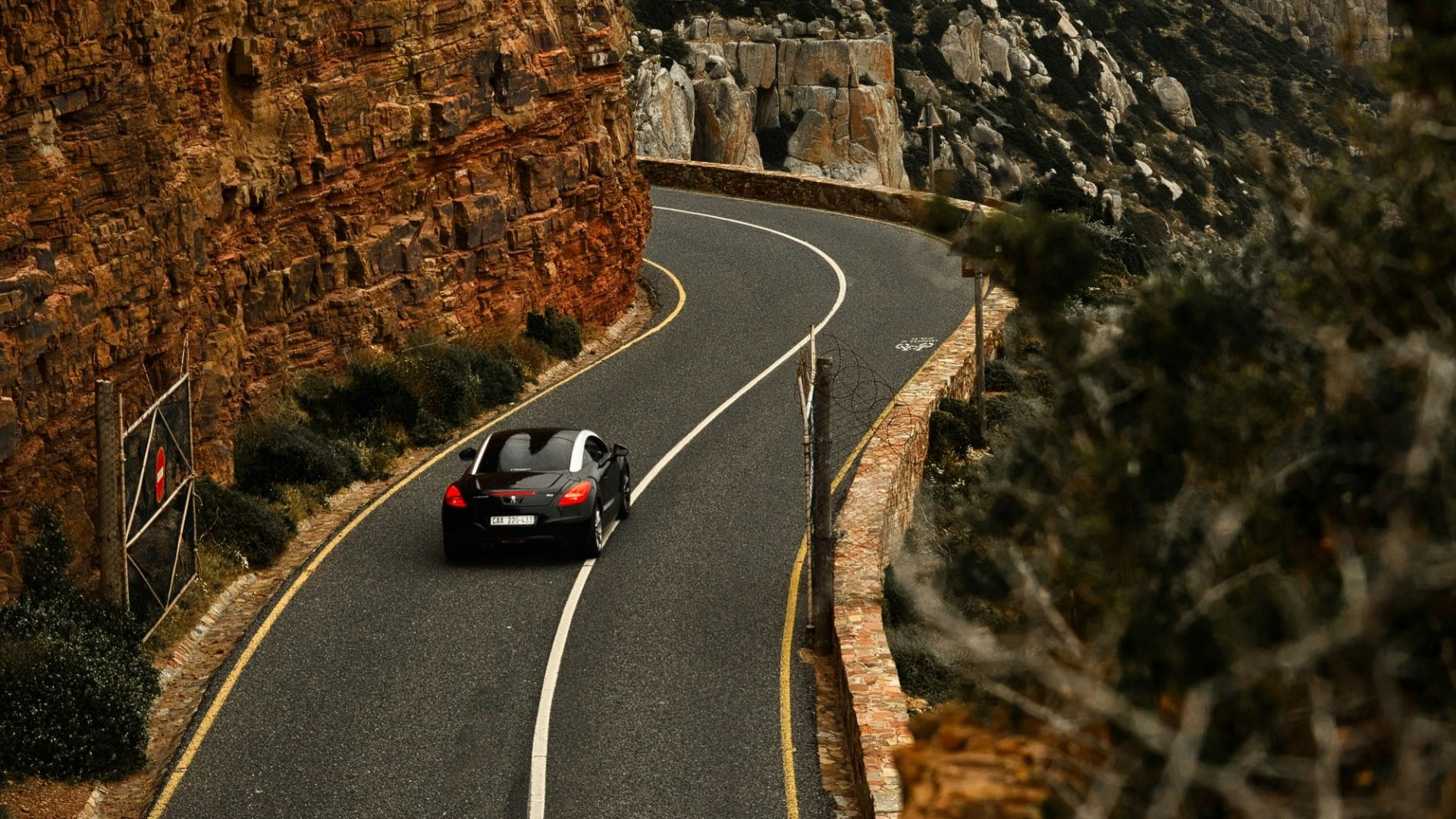 a car driving down a winding mountain road