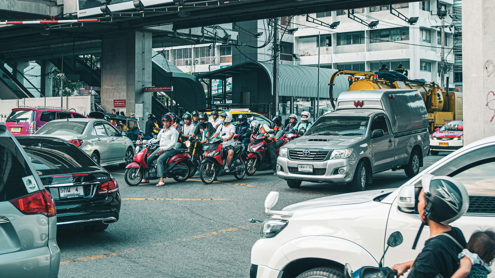 people riding motorcycle on road during daytime