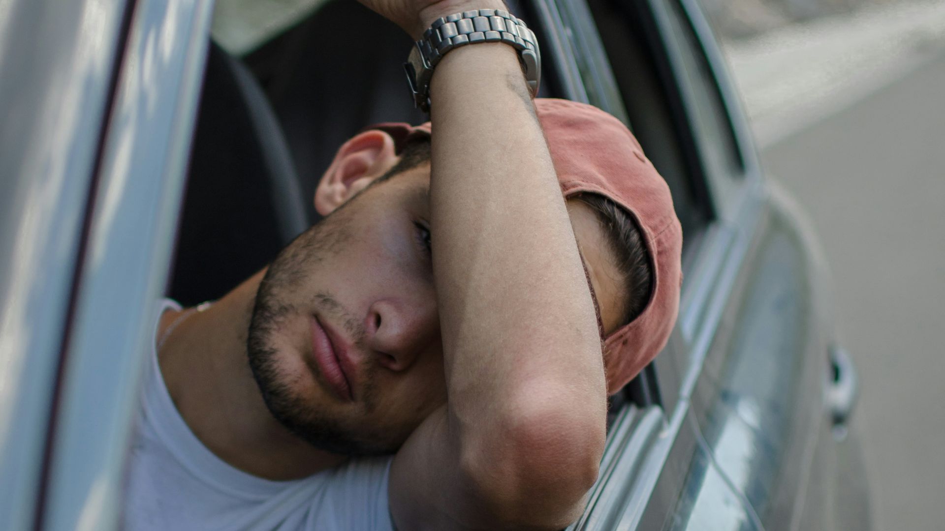 man sitting inside car