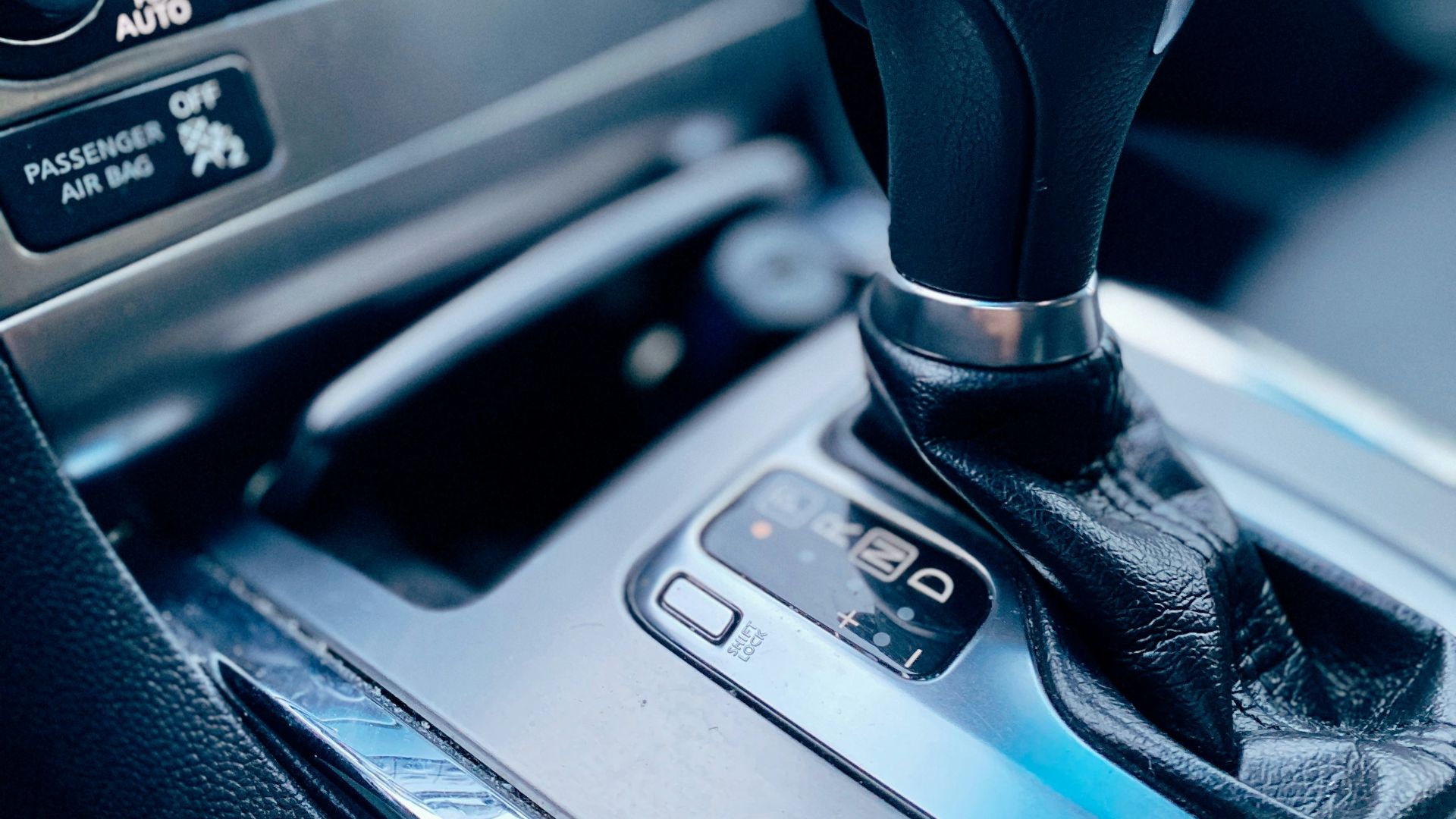 black and silver car gear shift lever