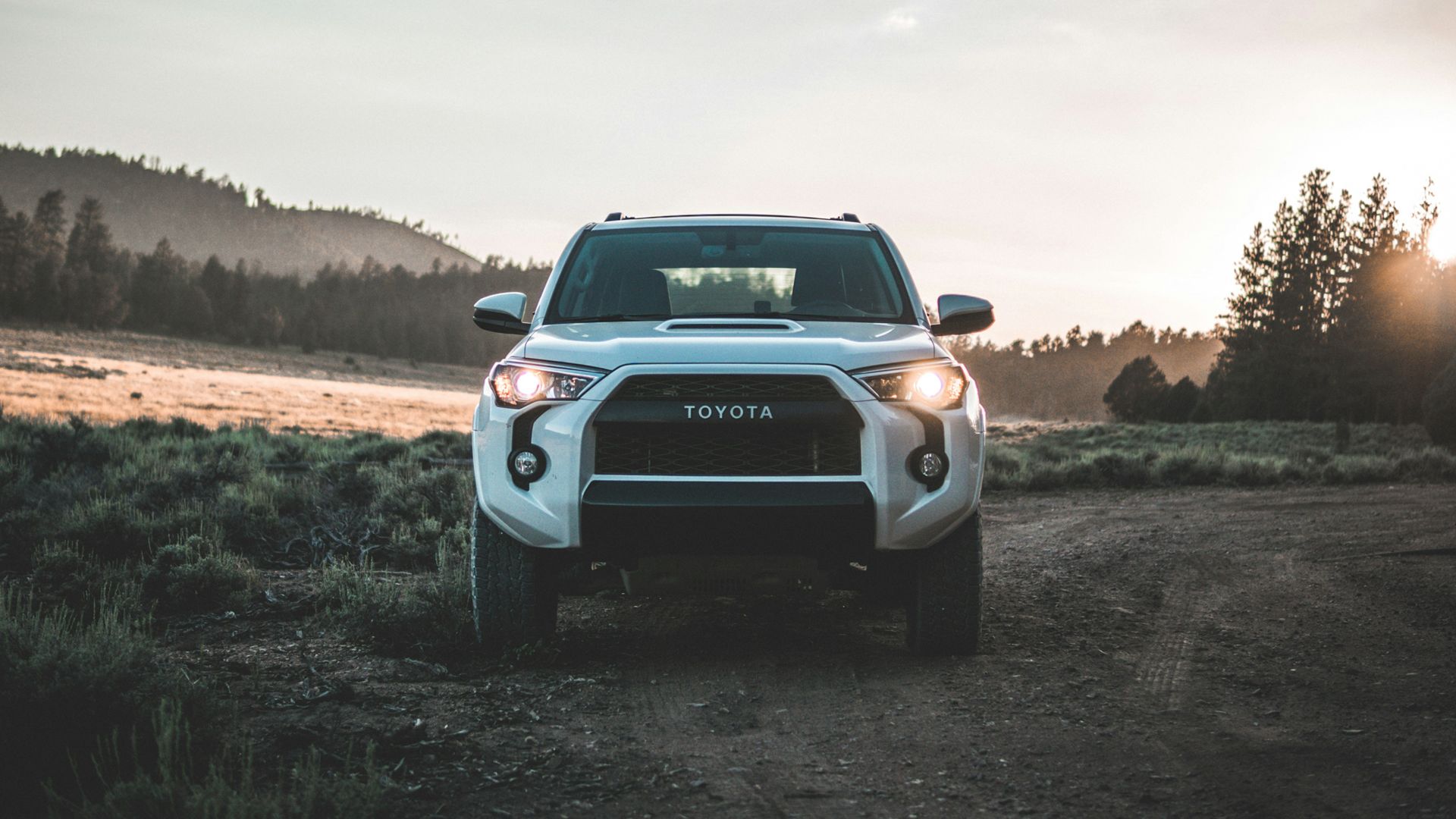 parked white Toyota vehicle