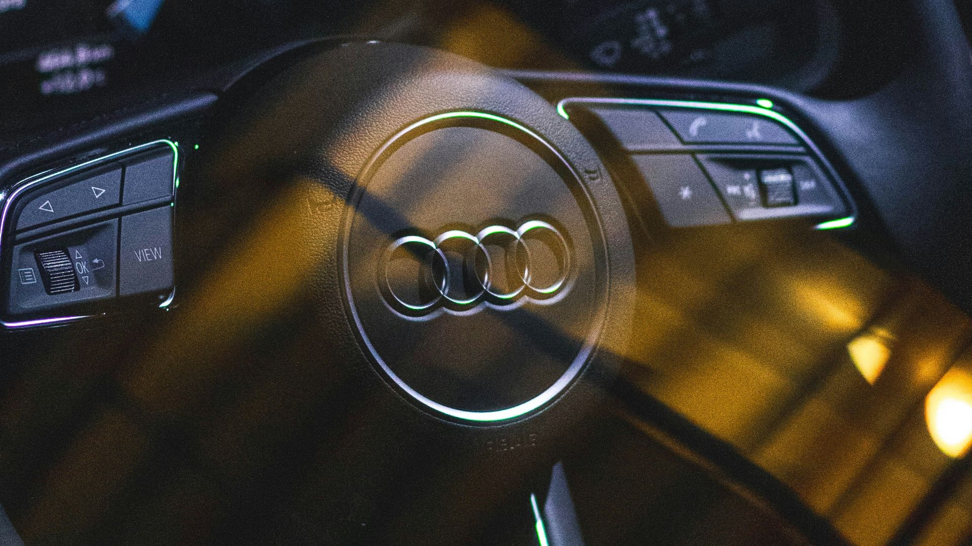 black and silver mercedes benz steering wheel