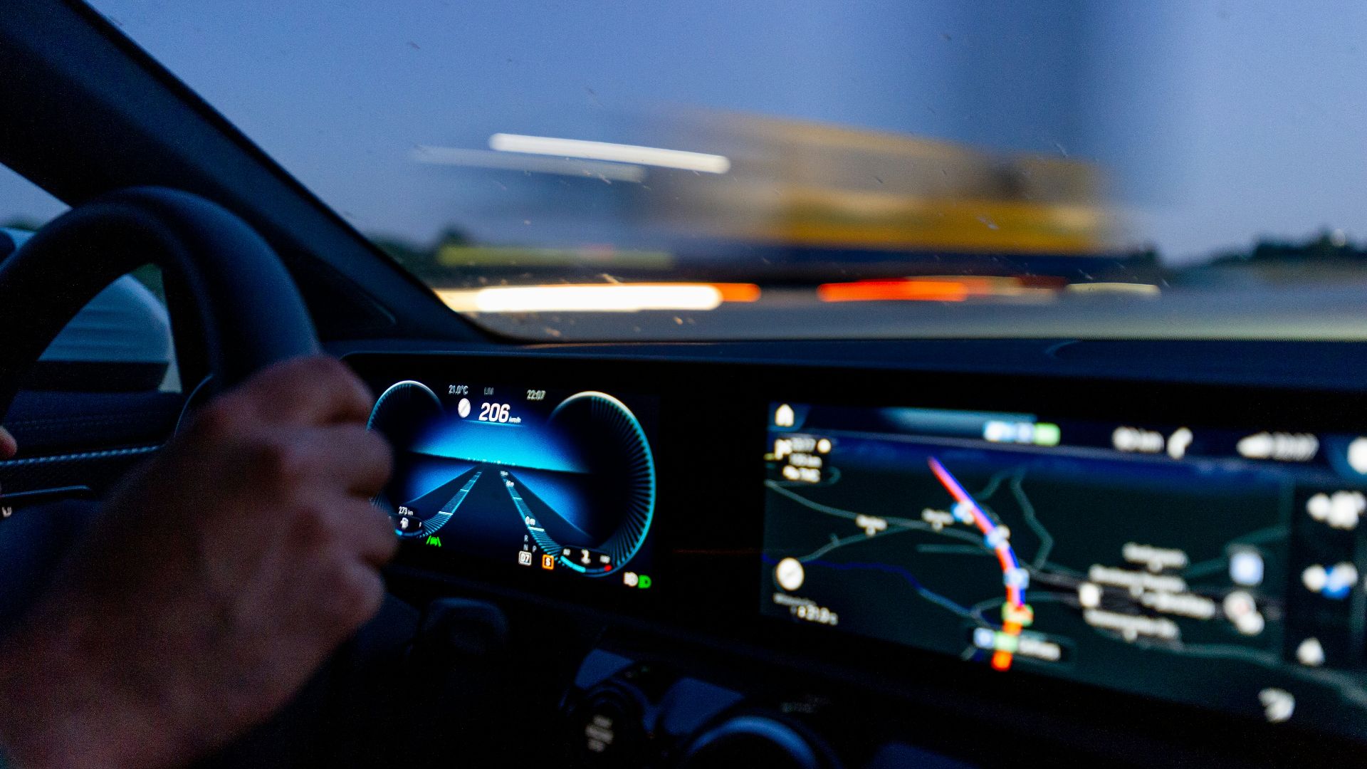 person's hand on steering wheel