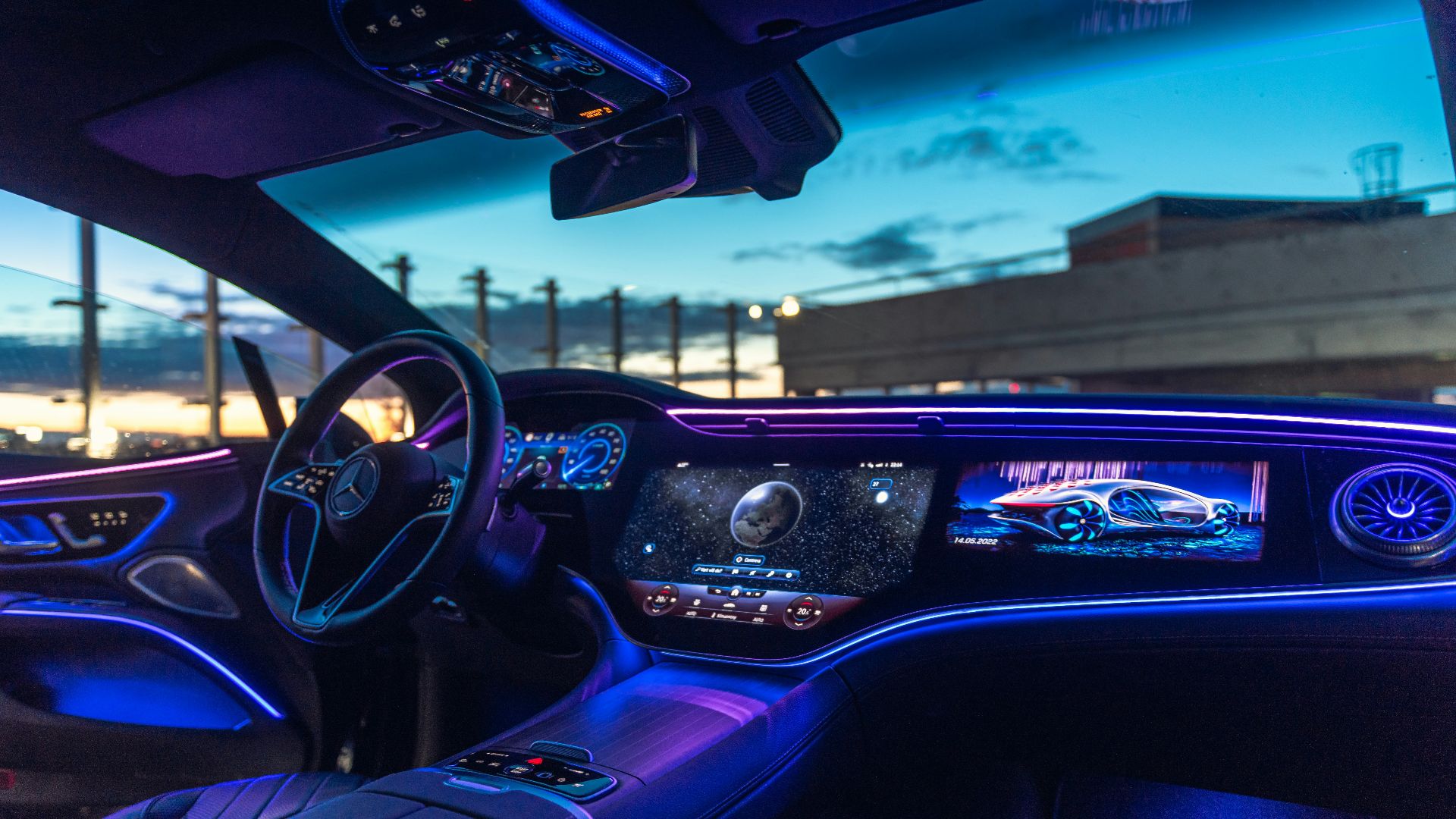 the interior of a car with blue lights