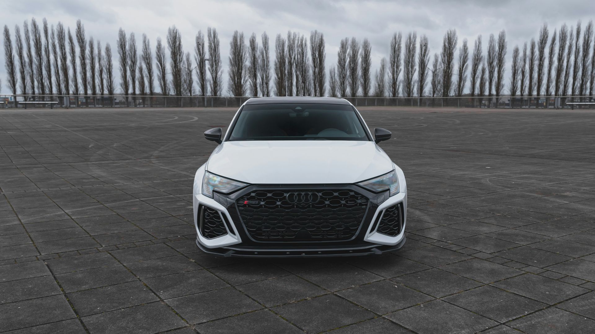 a white car parked in a parking lot