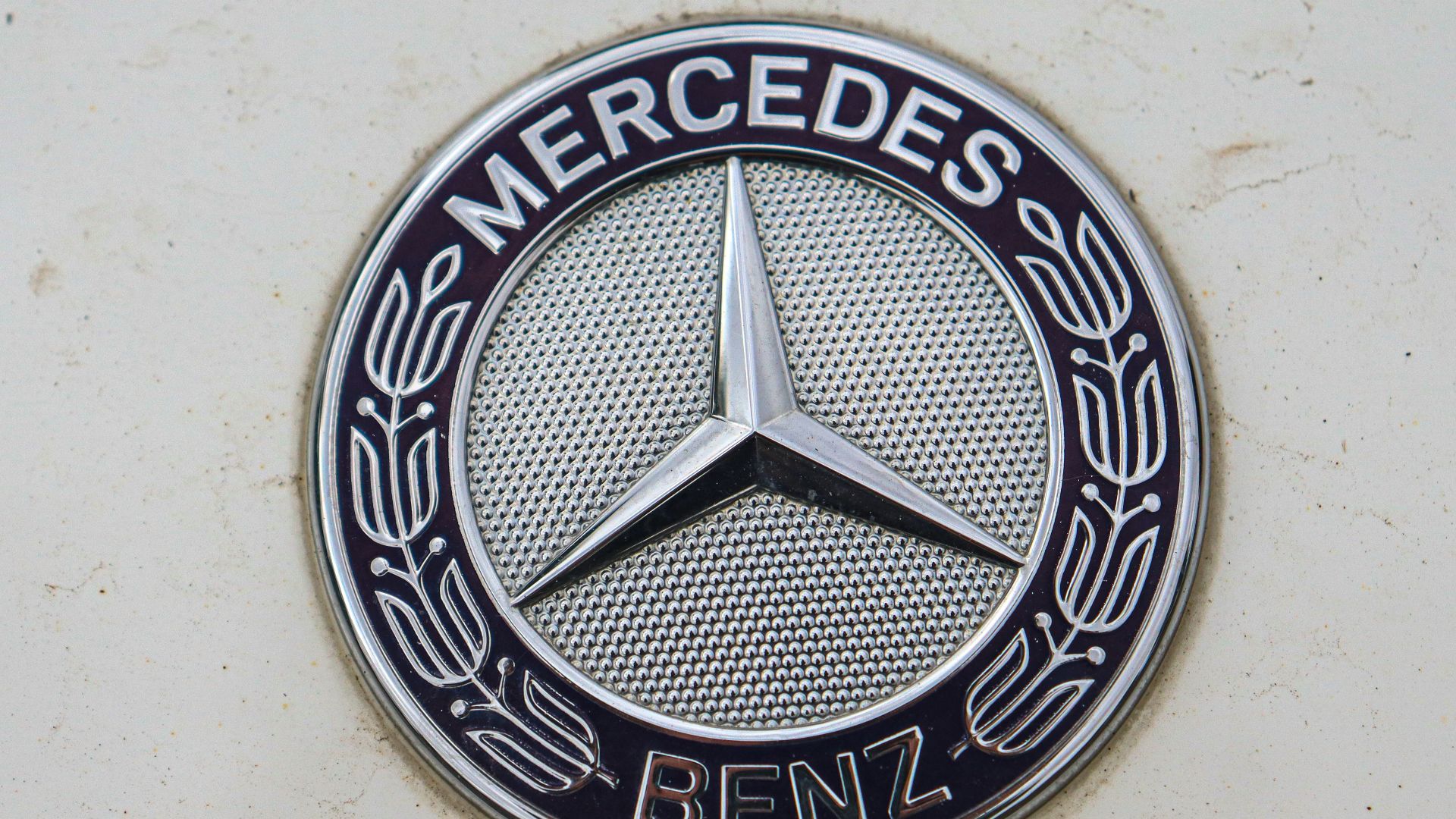 a mercedes emblem on the side of a car