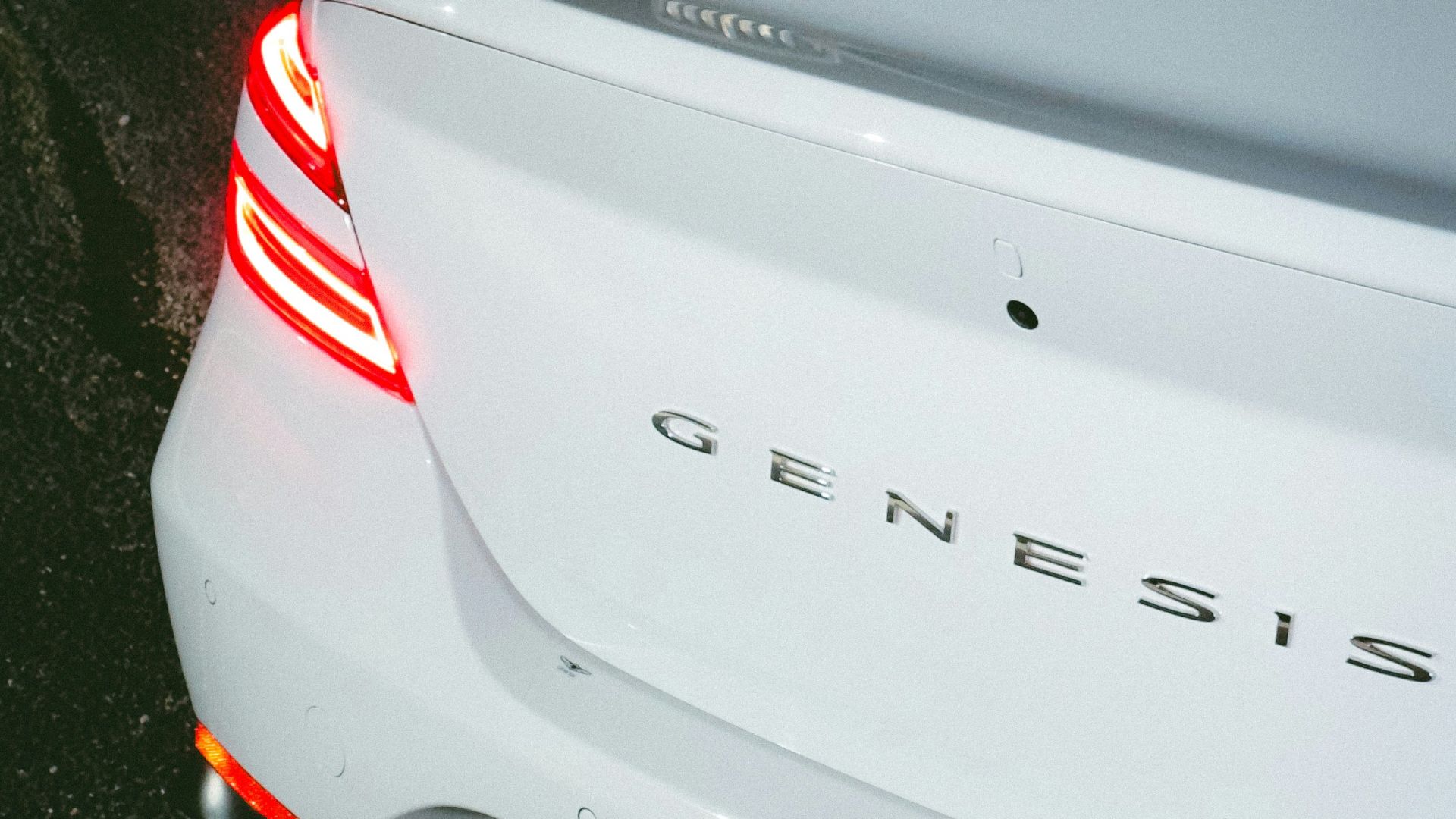 a white car parked on the side of the road