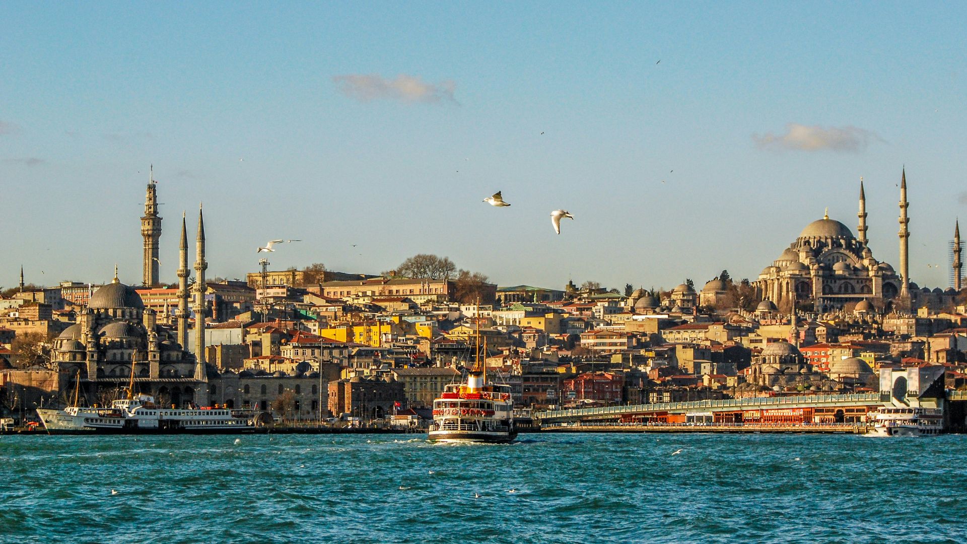 city buildings near body of water during daytime