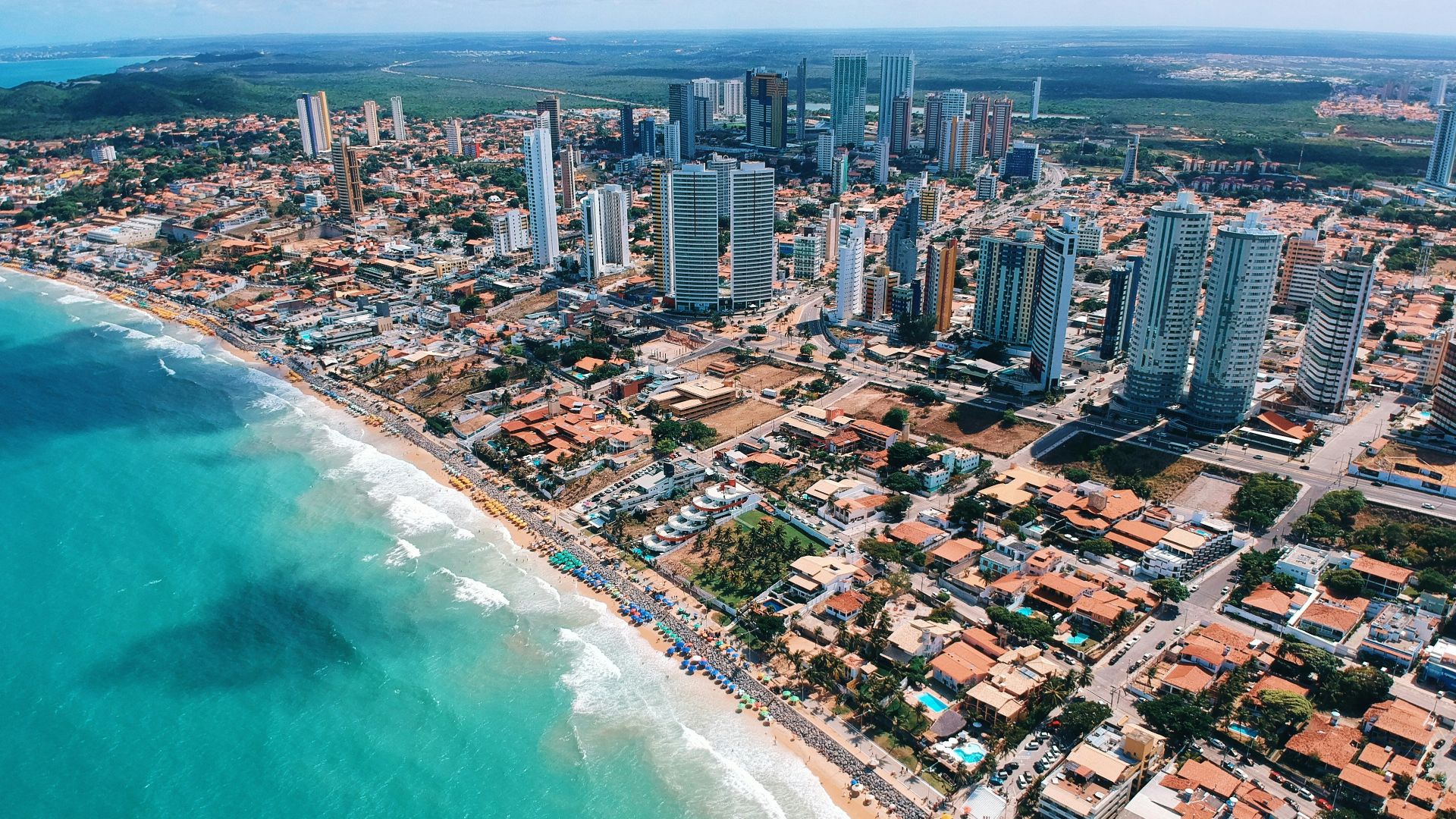 aerial photography of city building near the seashore during daytime