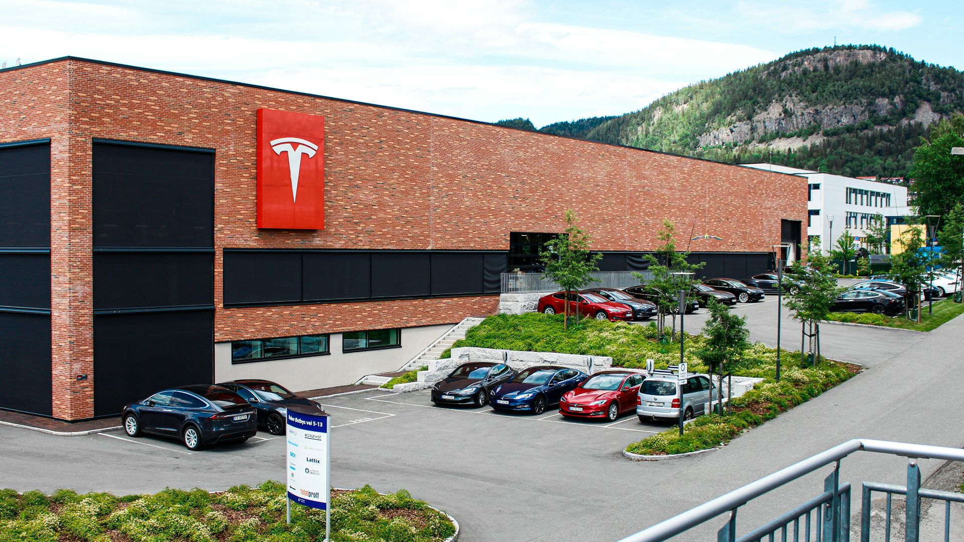 cars parked beside building during daytime