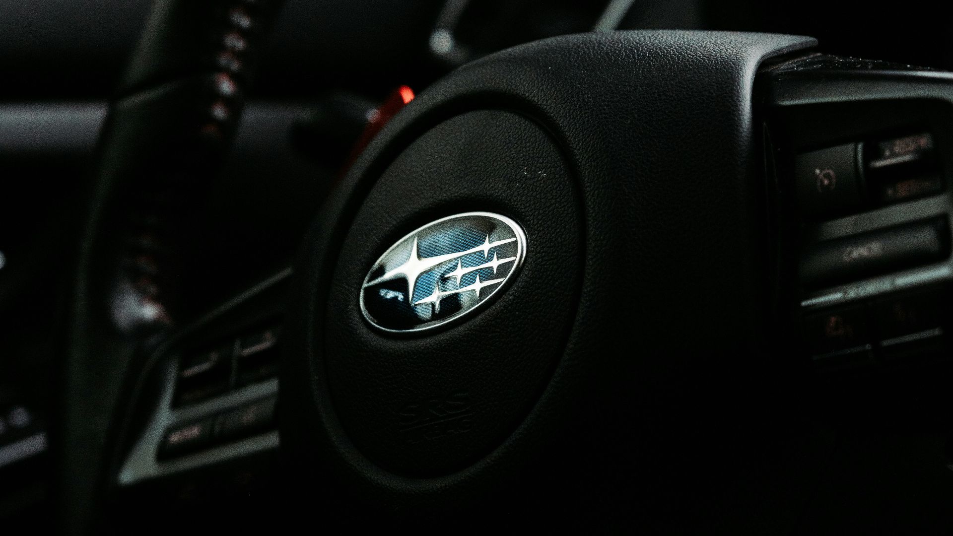 black nissan car steering wheel