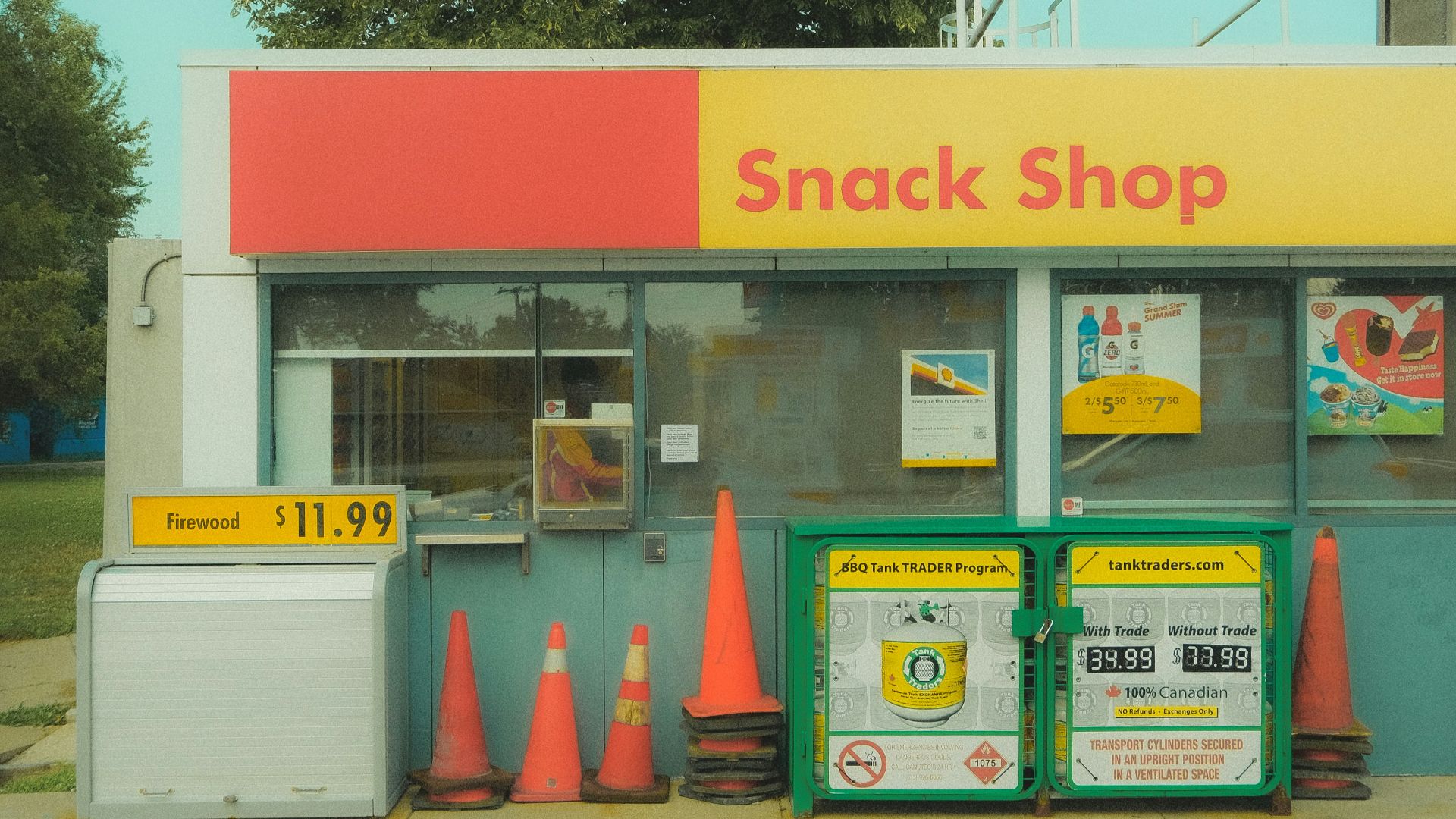 A snack shop with cones on the side of the road