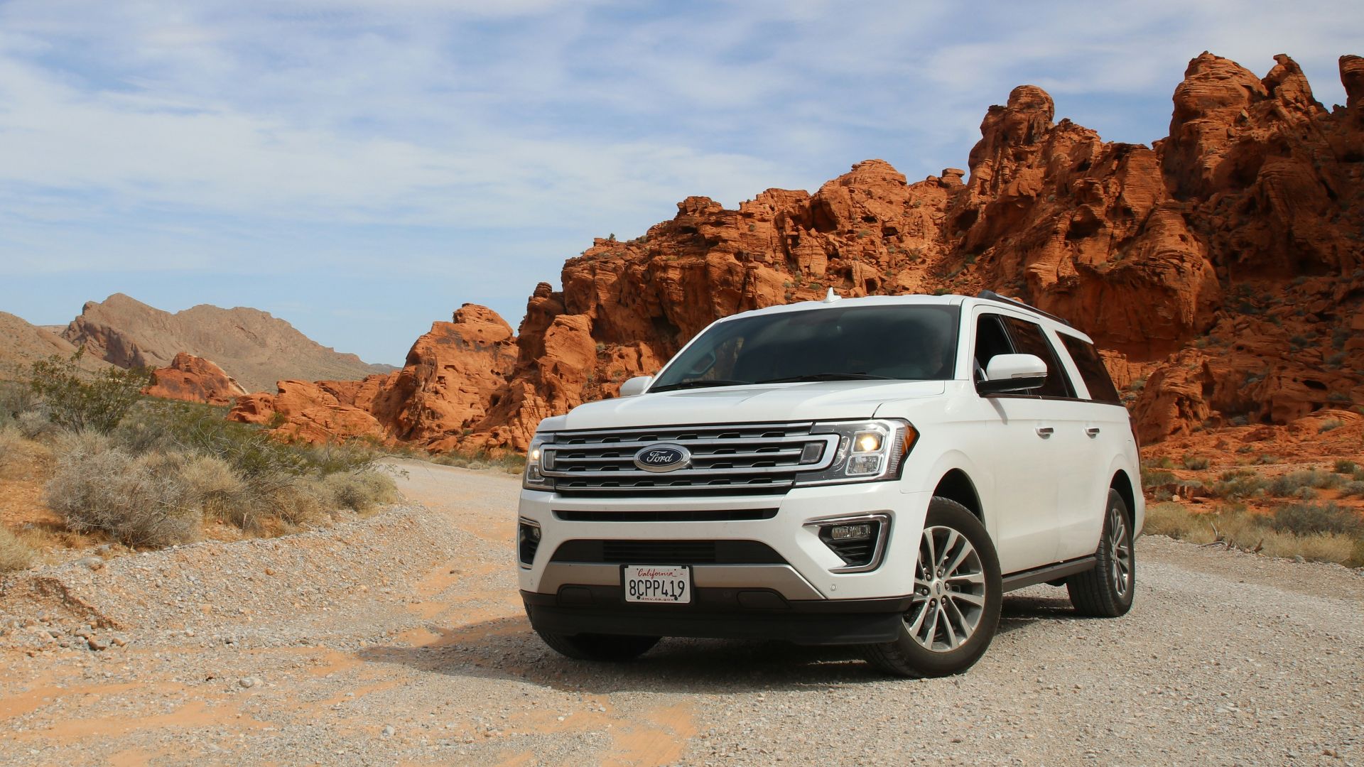 parked white Ford Explorer SUV