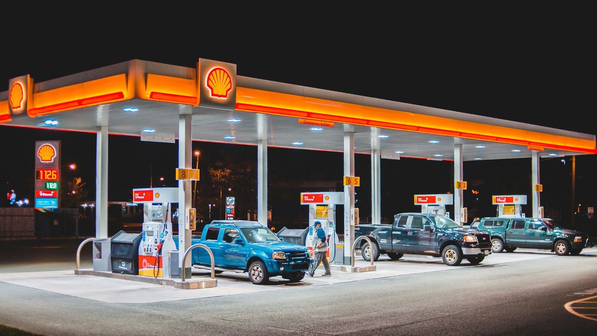 cars parked in front of store during daytime