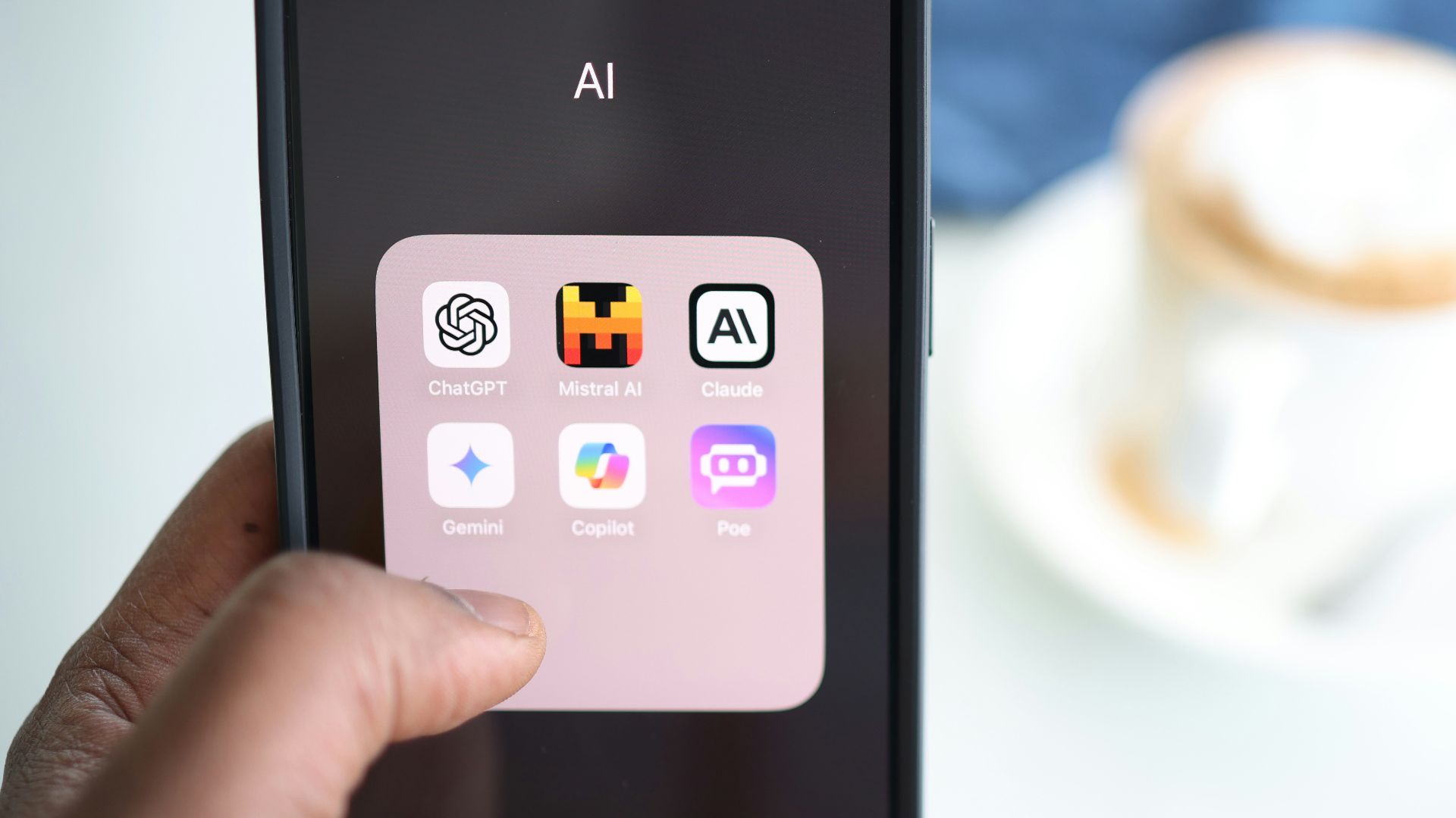 a person holding a cell phone in their hand