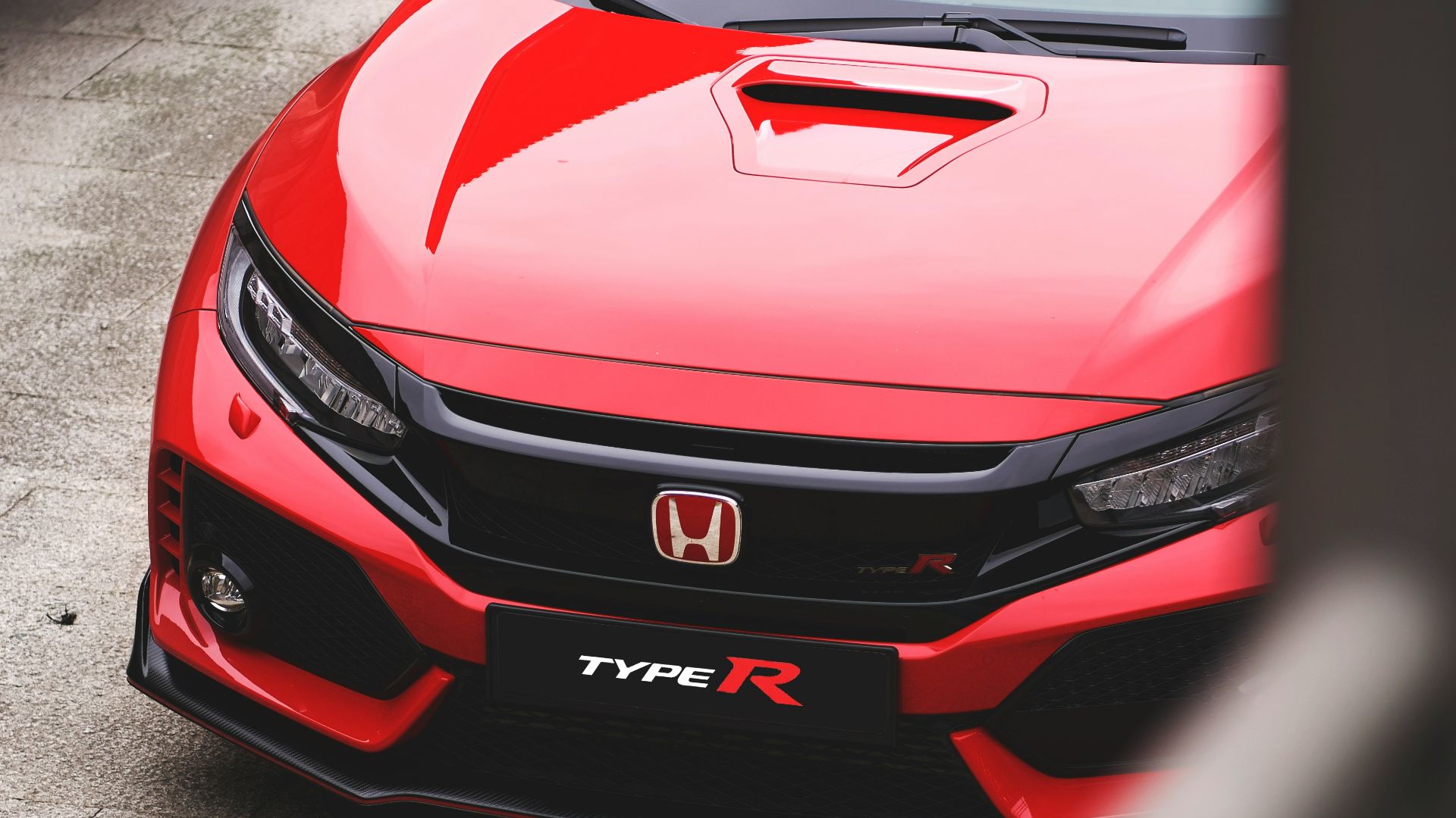 red Honda vehicle
