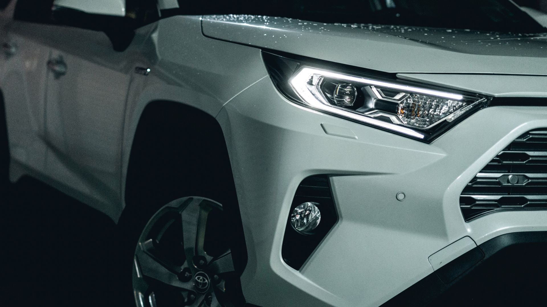 white and black car on black asphalt road