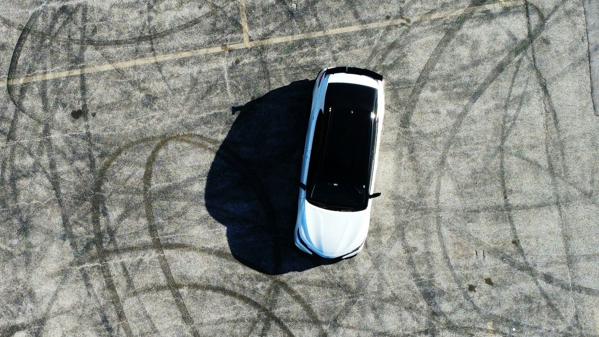 an aerial view of a car parked in a parking lot