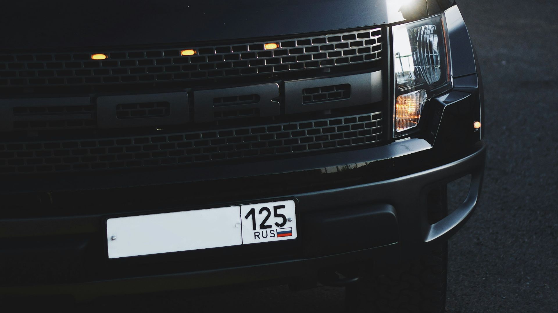 black chevrolet car on road during daytime
